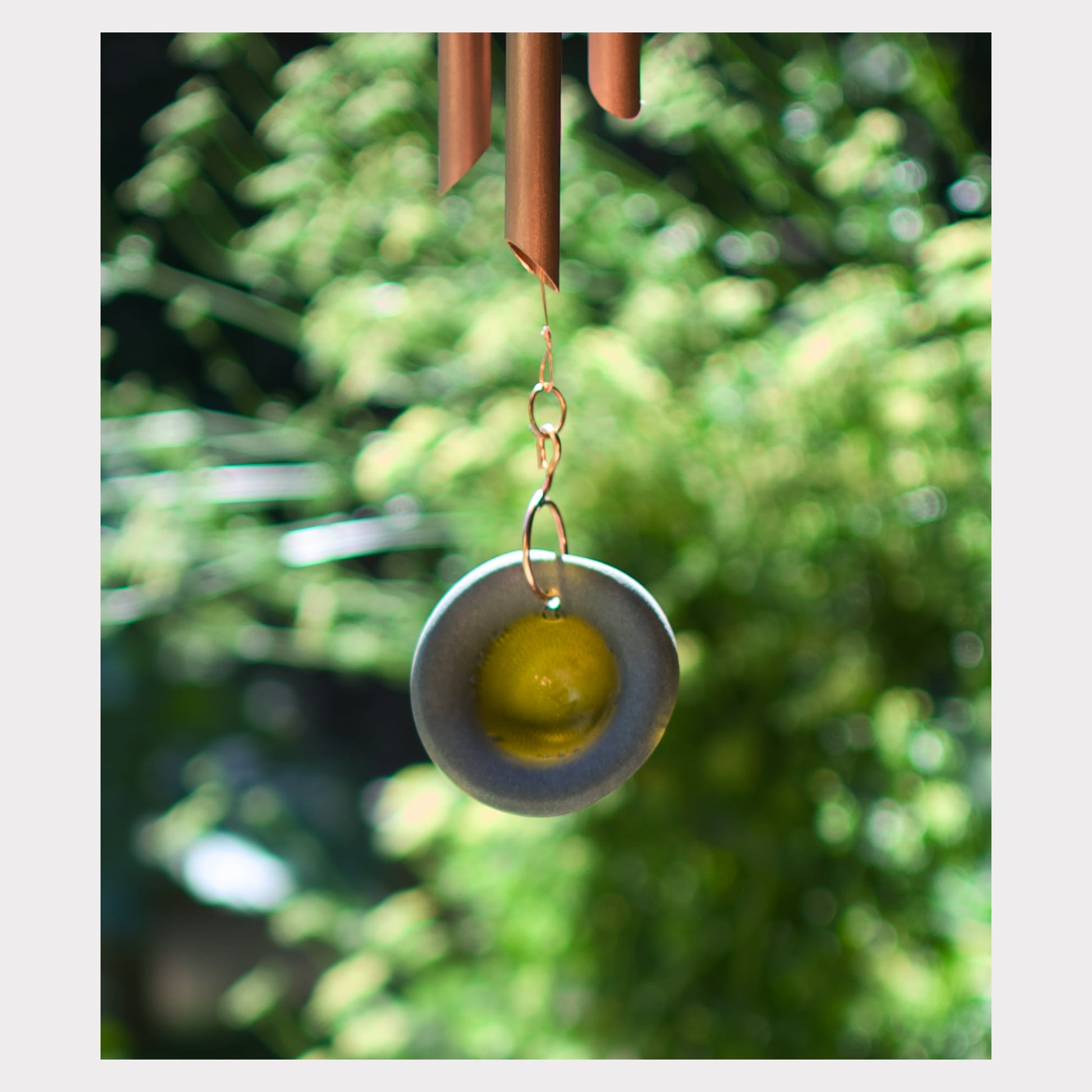 Detail, artist-made sea glass windsail for a large copper wind chime.