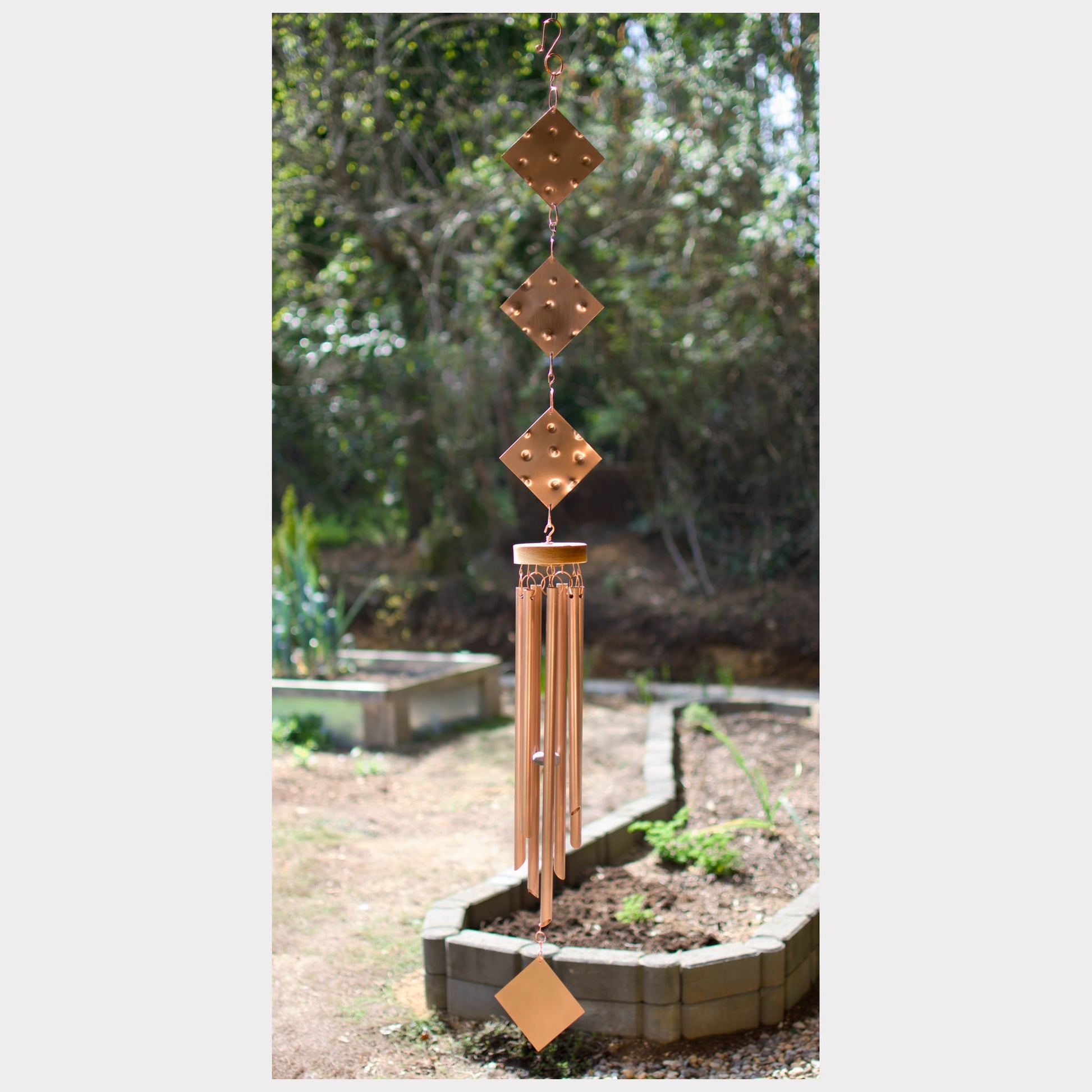 Large handcrafted copper wind chime by Coast Chimes, featuring seven chimes.