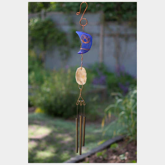 Cobalt blue sea glass with an oyster shell wind chime.