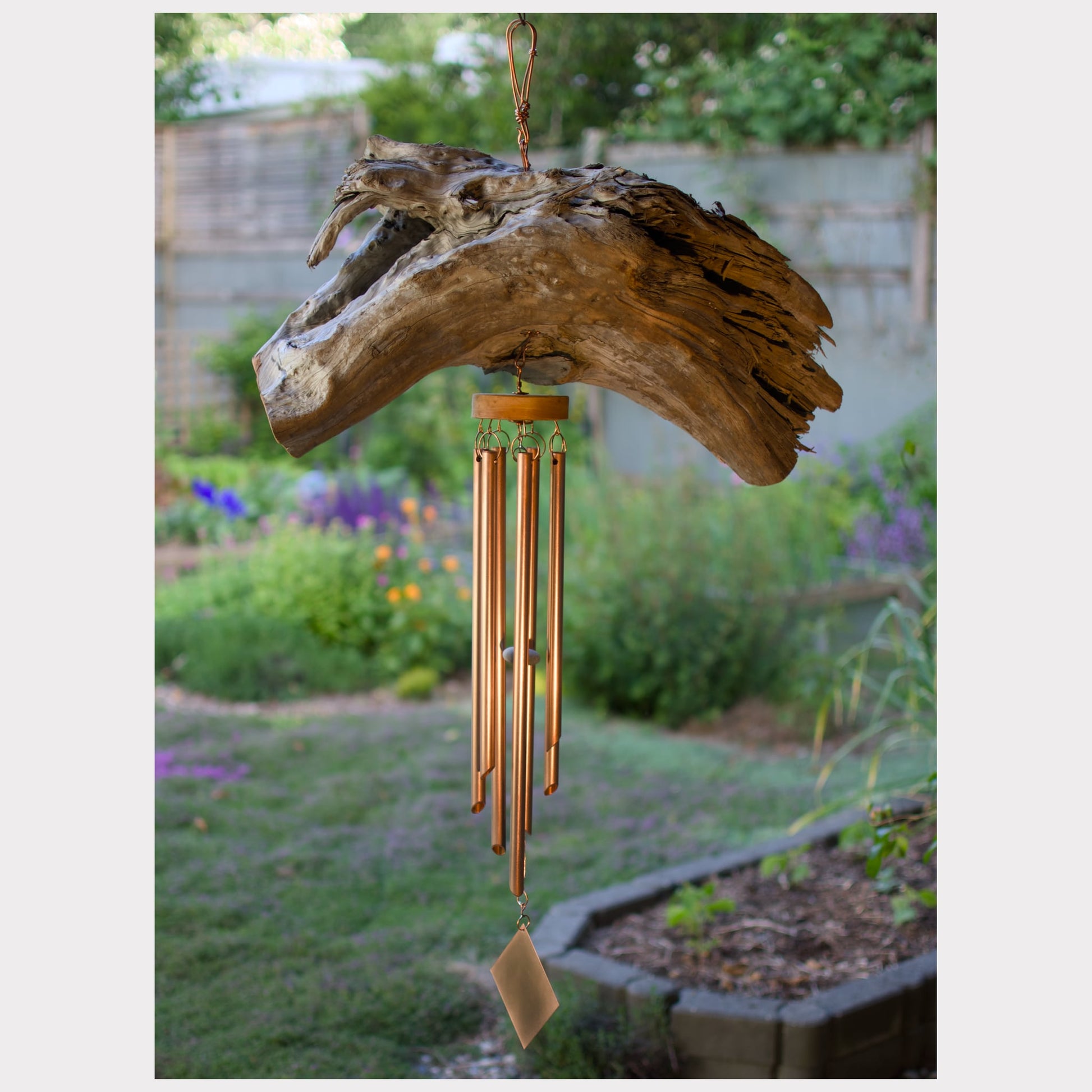 Very large natural driftwood wind chime with seven copper chimes.