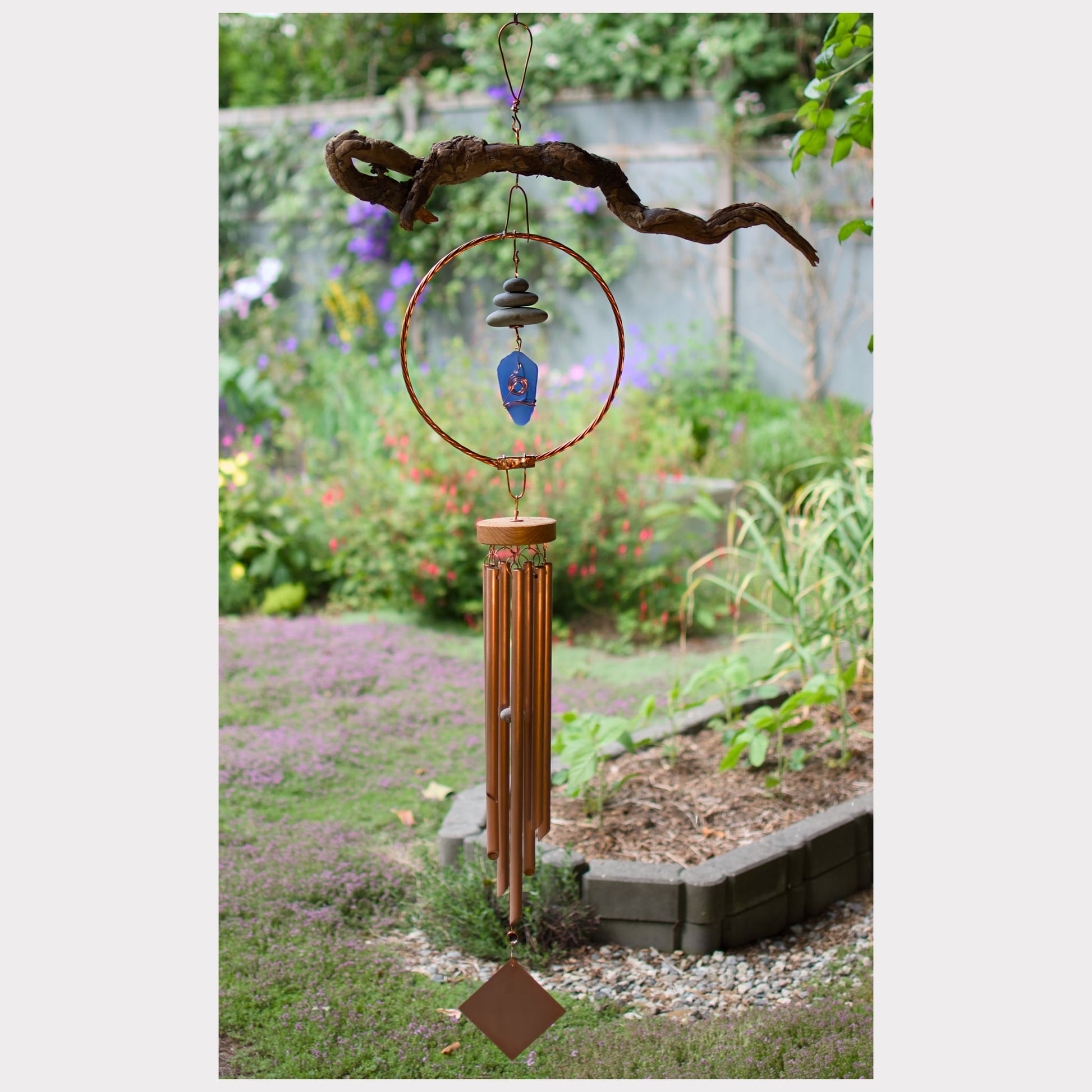 Large natural driftwood wind chime with copper, beach stones, sea glass.