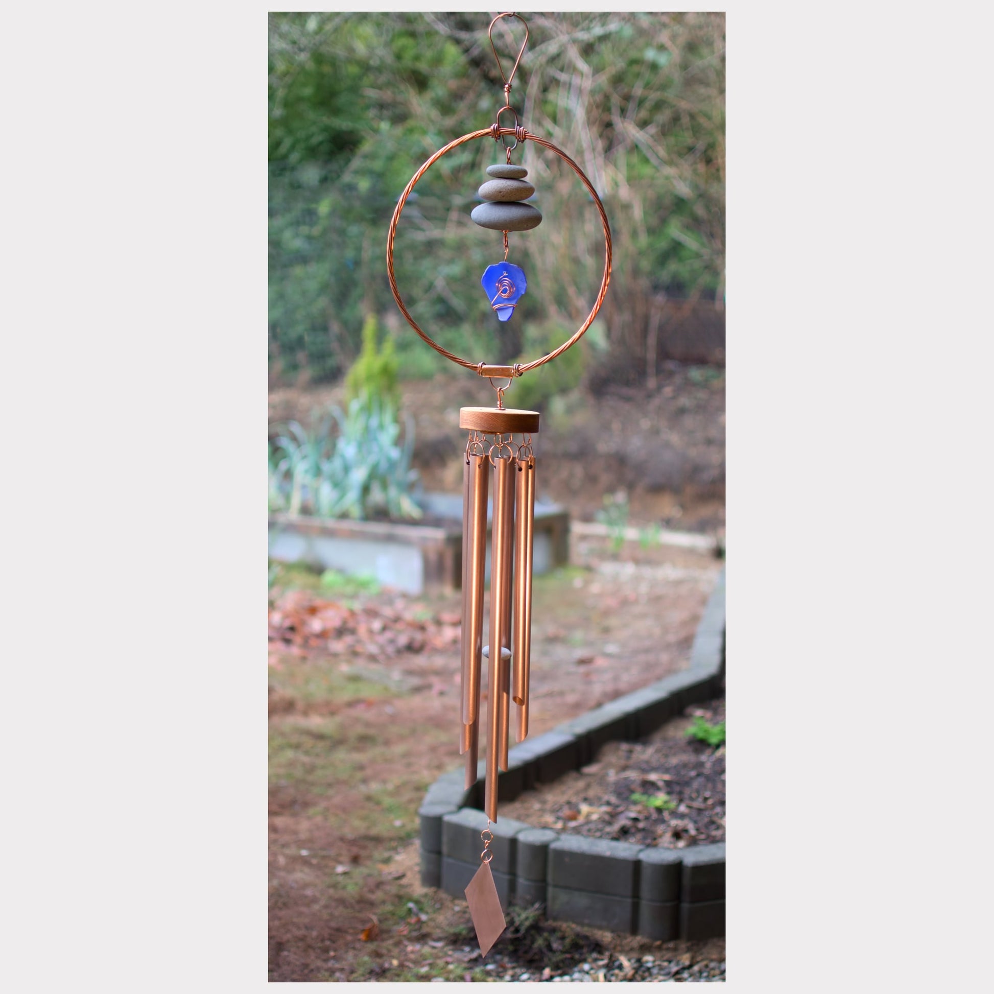 Large copper wind chime with beach stones and artist-made beach glass.