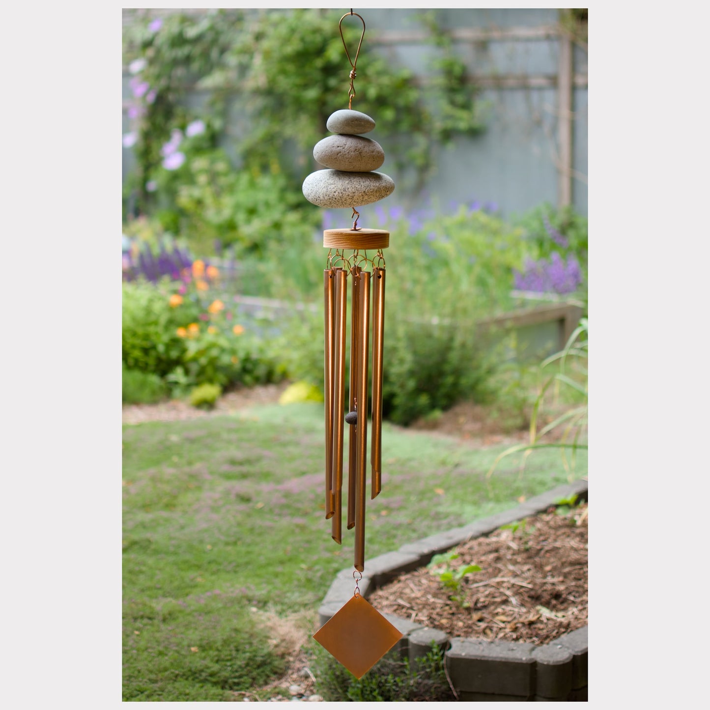 Zen natural beach stone wind chime with seven copper chimes.