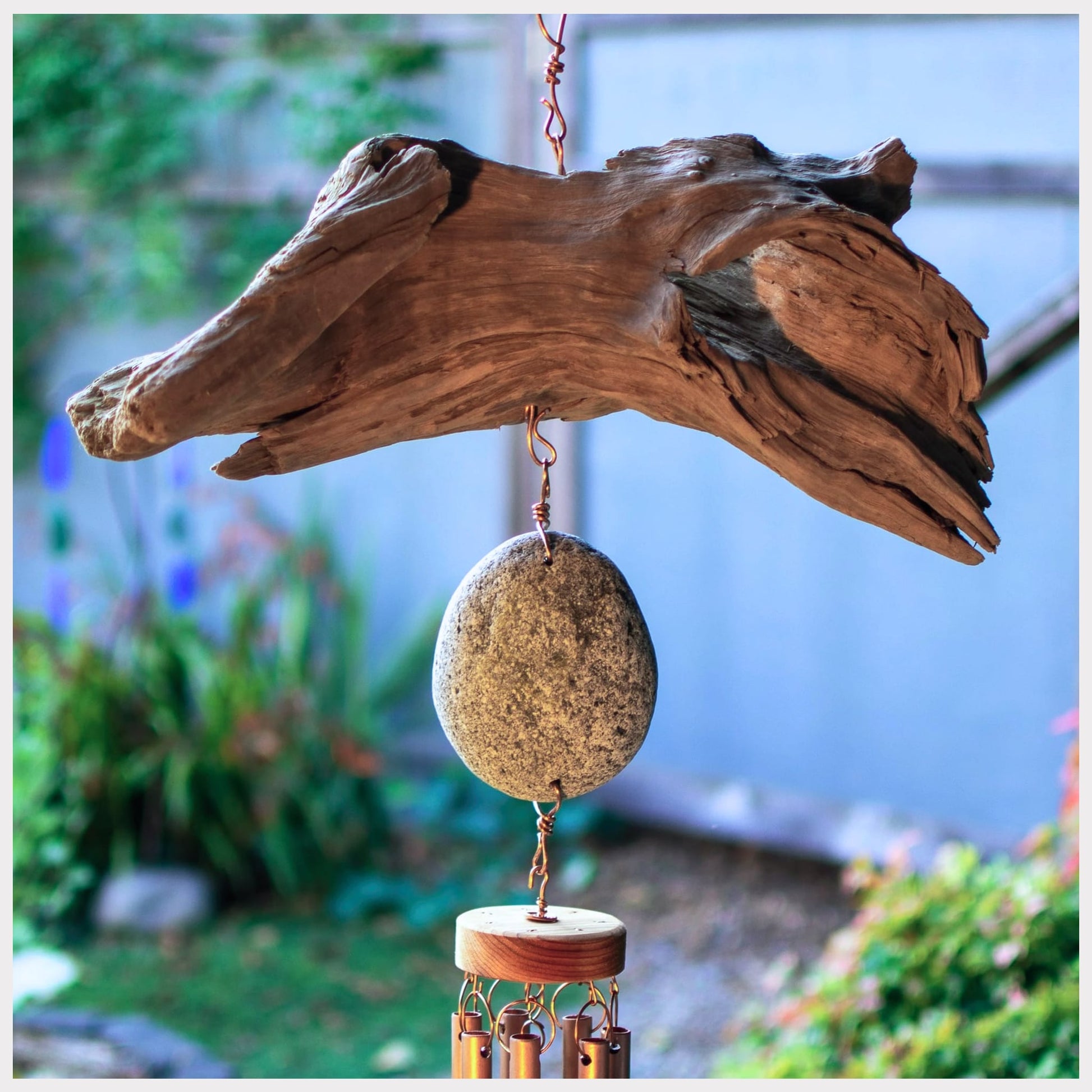 detail, driftwood and beach stone wind chime