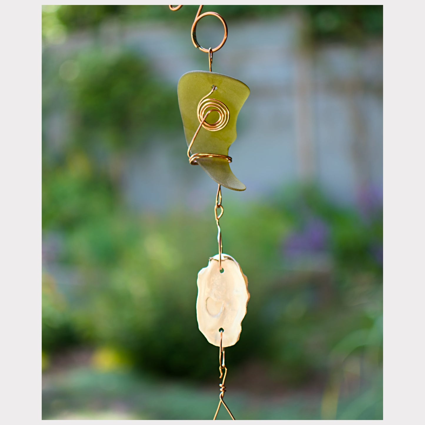 detail, glass and oyster shell wind chime