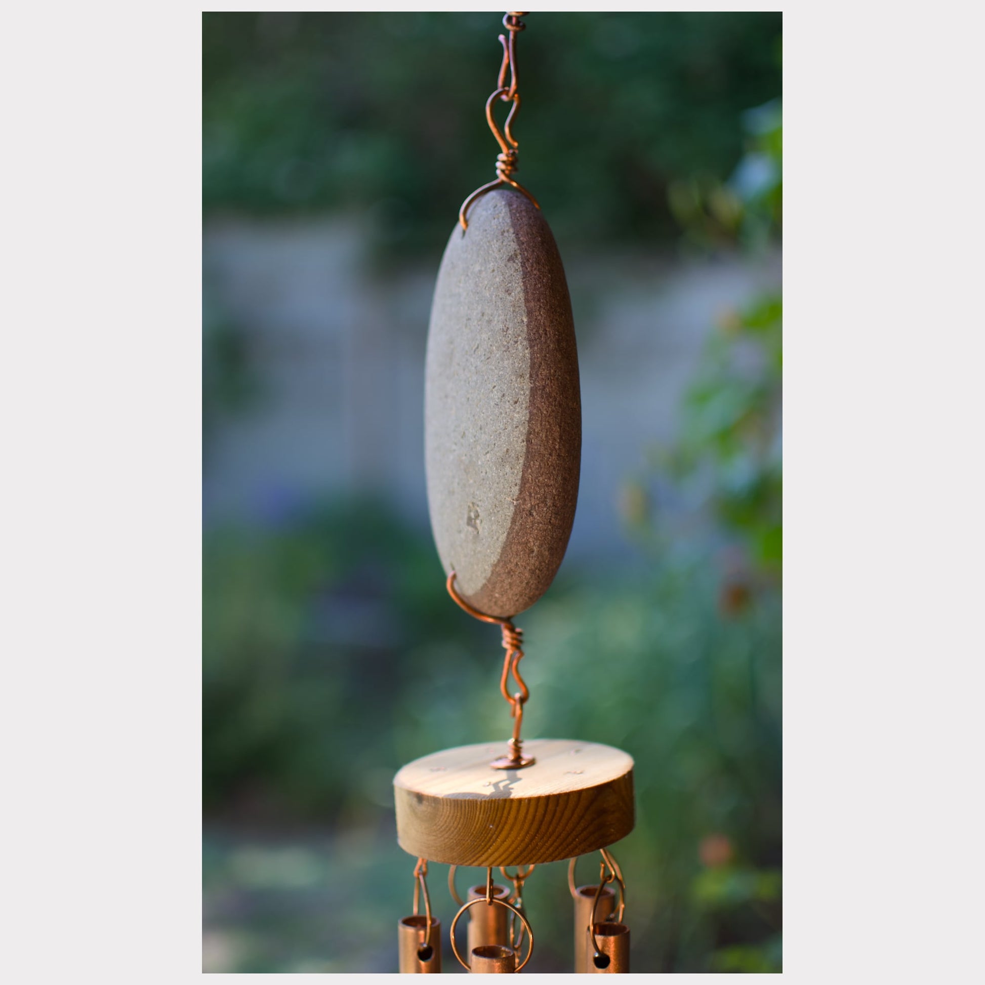 side view, beach stone wind chime