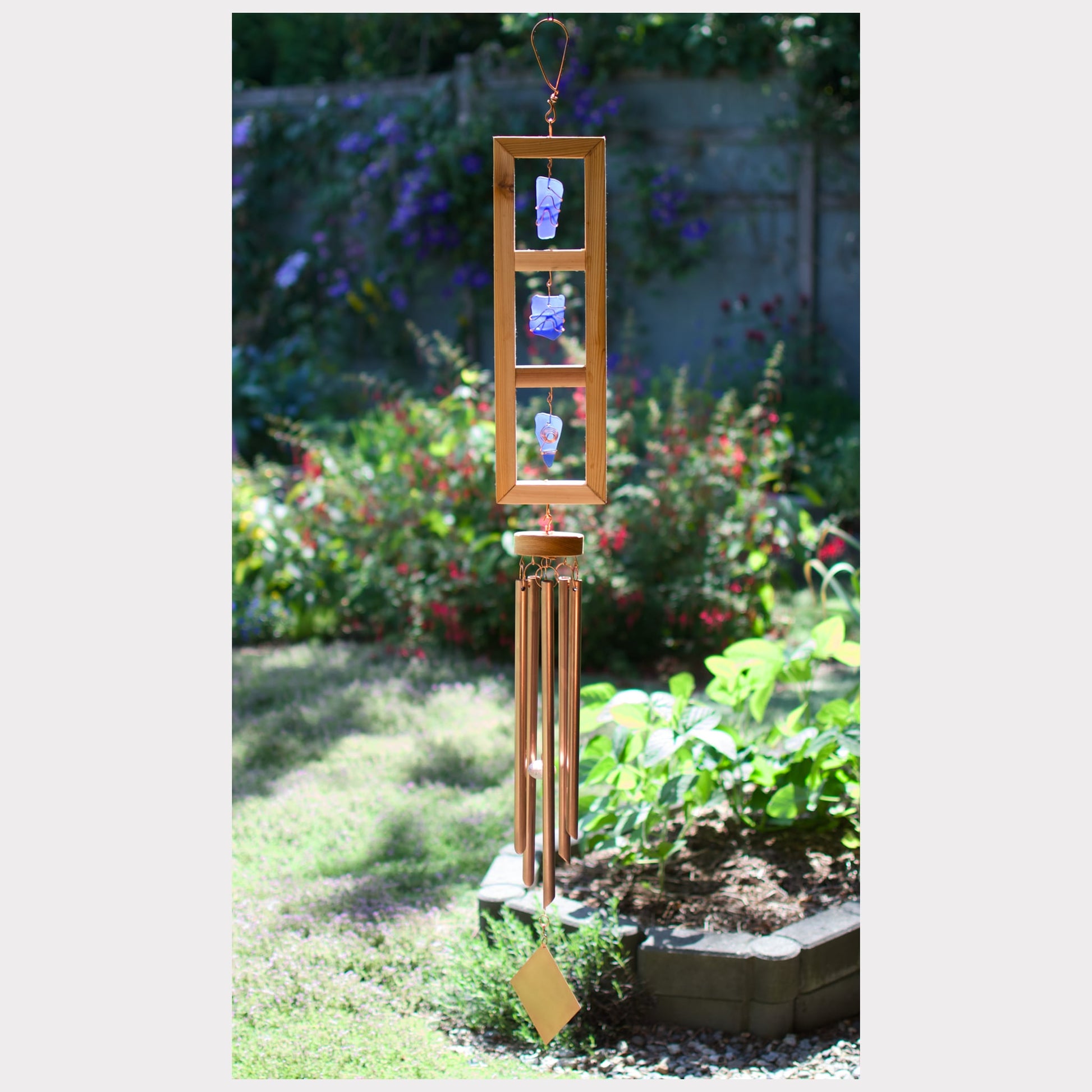 Cedar and cobalt blue sea glass wind chime with five copper chimes.