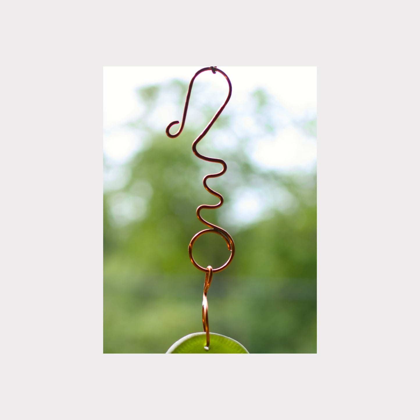 Handmade fancy copper hook for a wind chime.