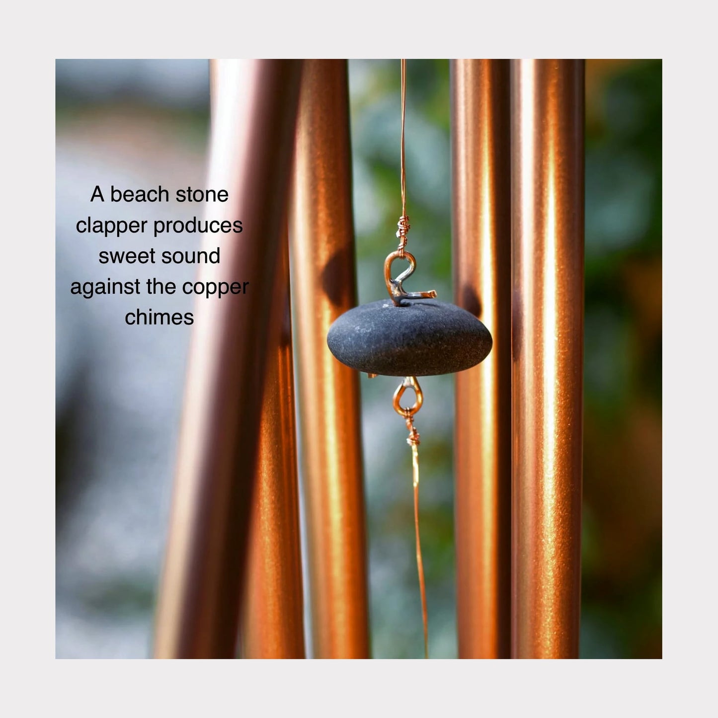 Beach stone clapper for a wind chime.