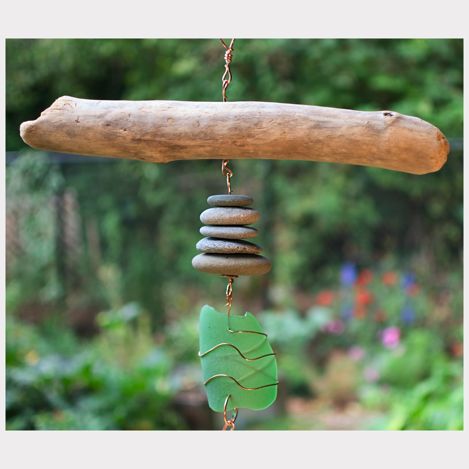 Detail, driftwood, beach stone, sea glass wind chime.