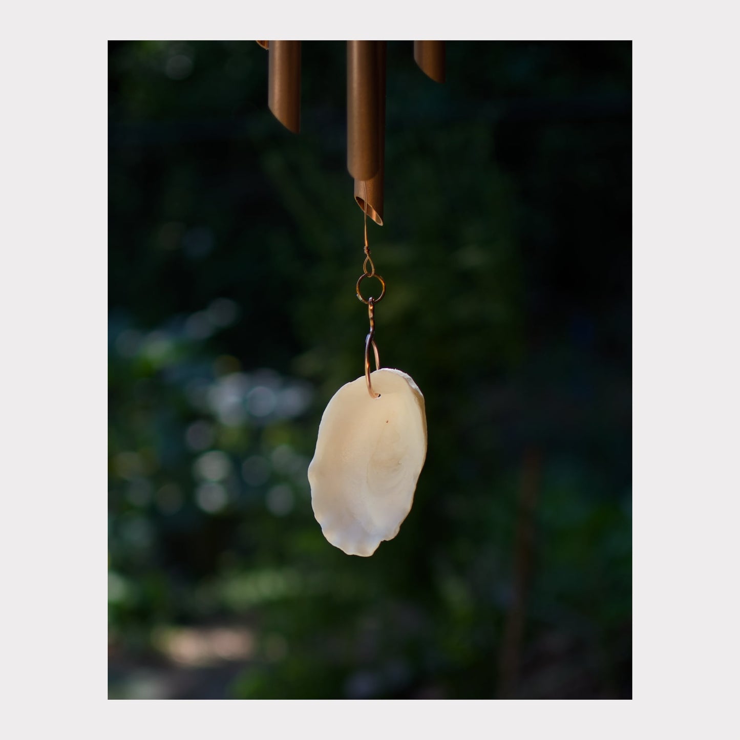 Detail, oyster half shell windsail for a large wind chime.