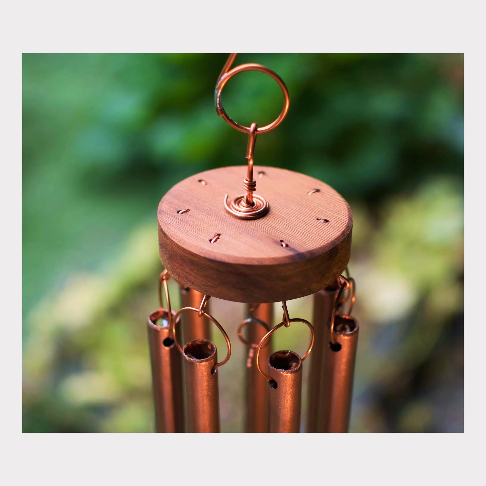 top of a handmade copper wind chime
