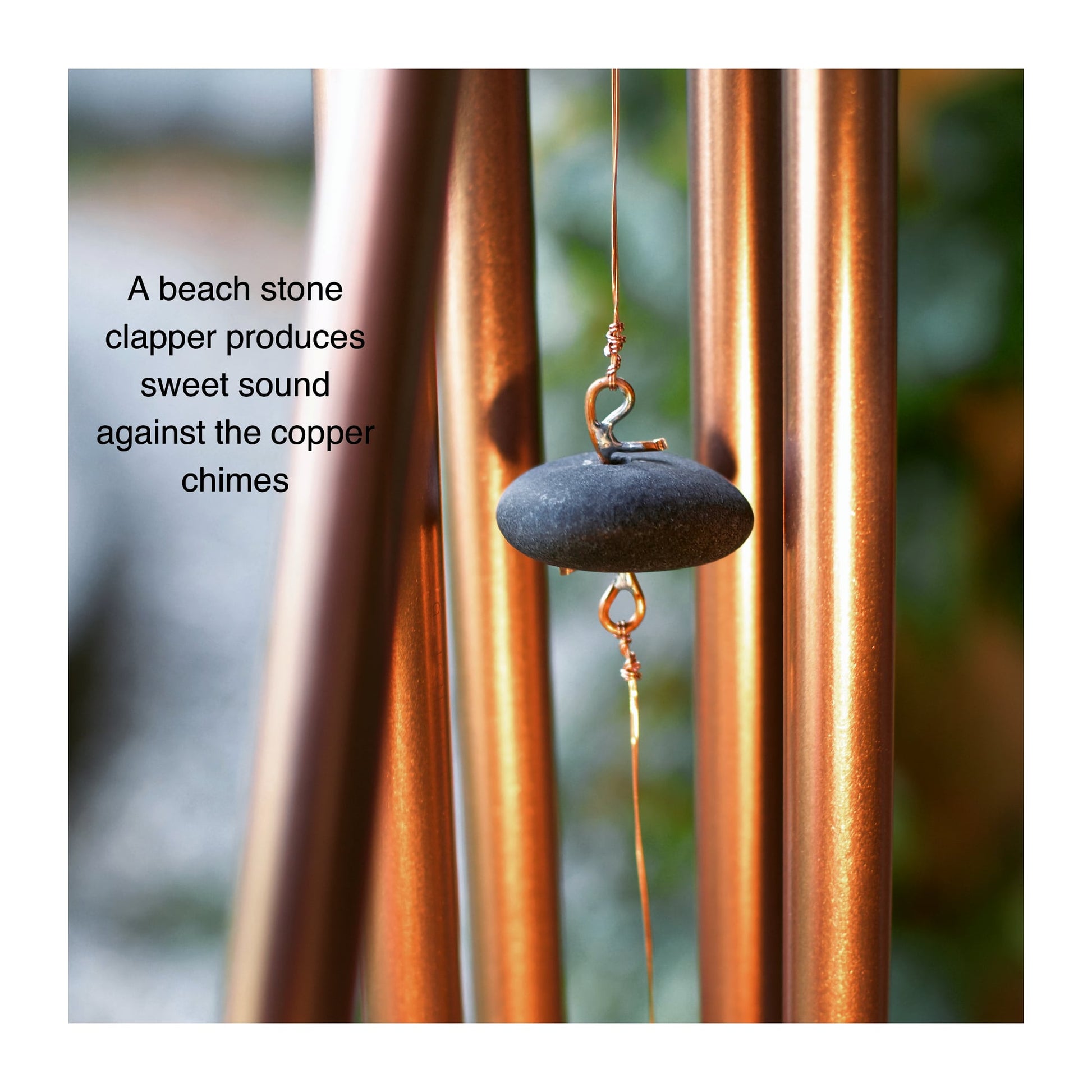 Beach stone clapper, or striker, for a copper wind chime.