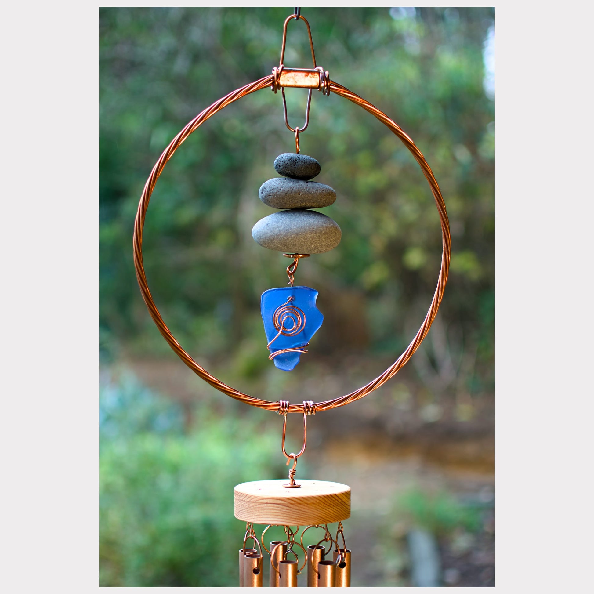 detail, beach stone and sea glass with copper chimes