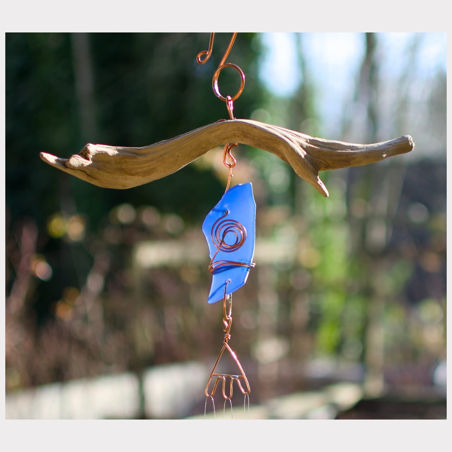 detail, driftwood with sea glass wind chime