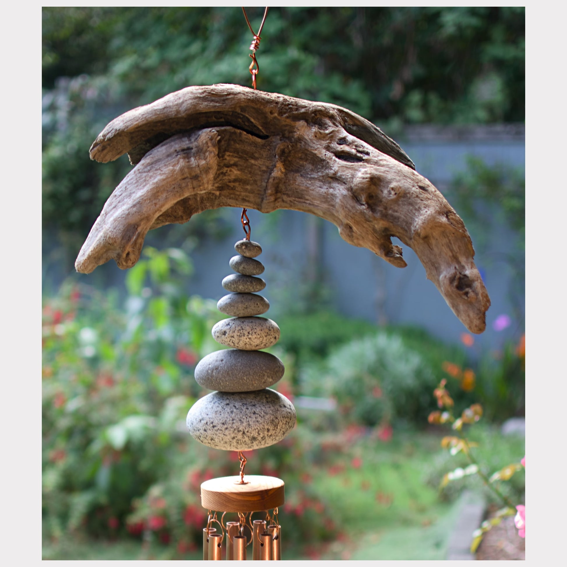 detail, driftwood and beach stone copper wind chime