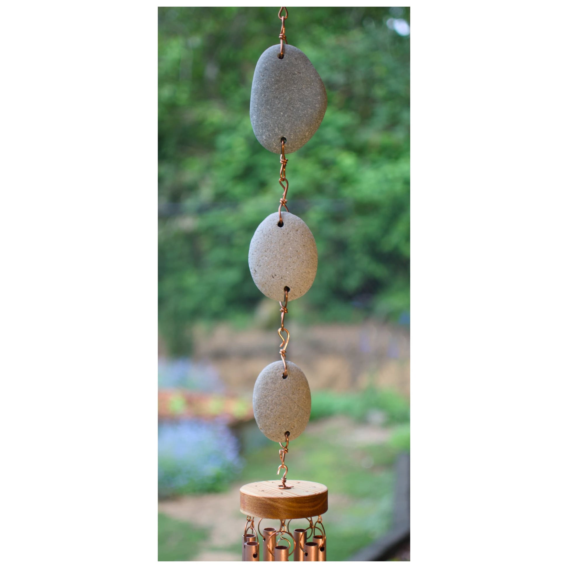 Detail, natural beach stone copper wind chime.