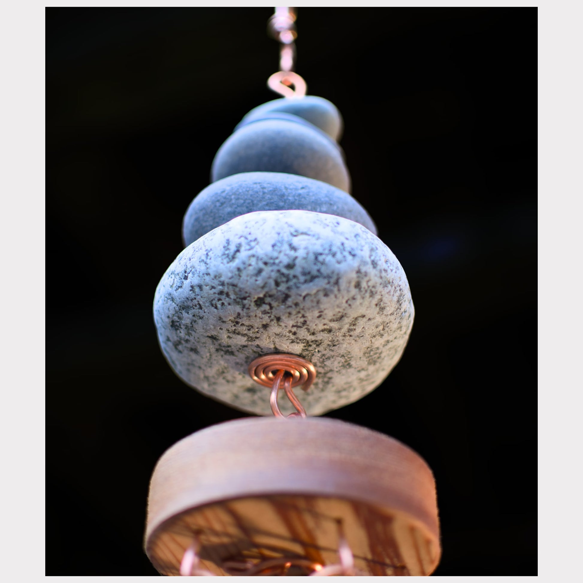 detail, bottom view, zen beach stone wind chime