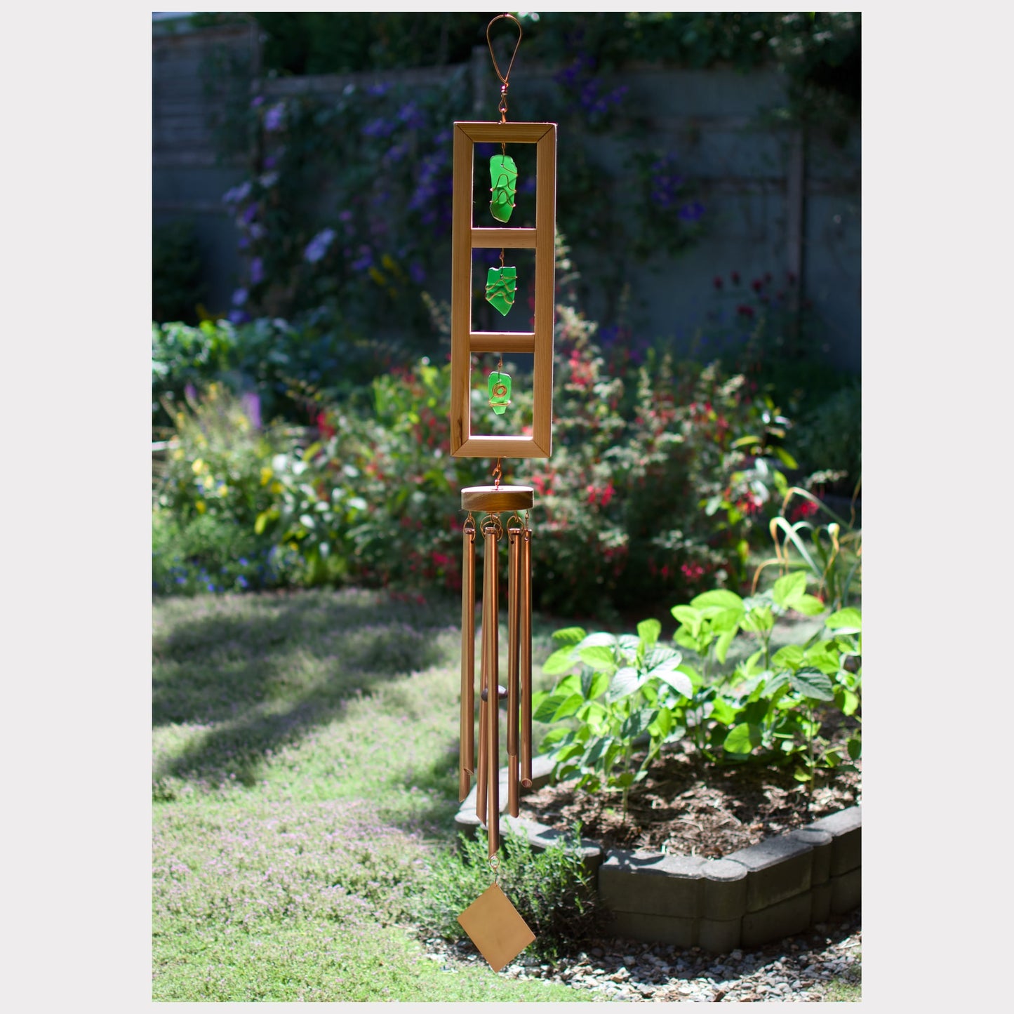 Large glass and cedar wind chime with seven copper chimes.