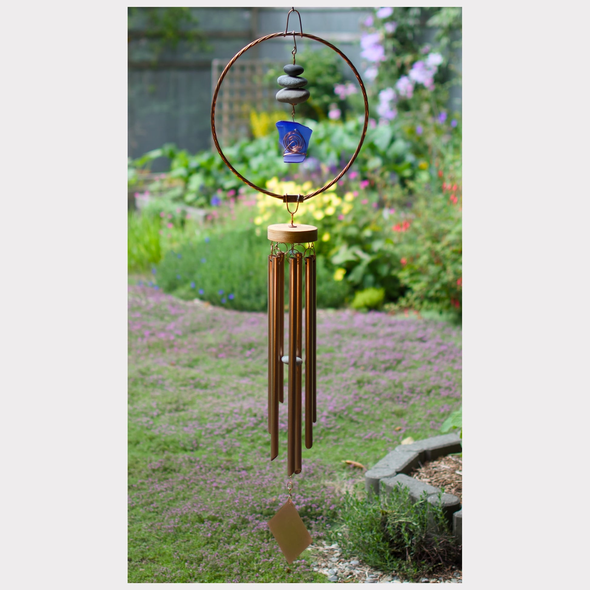 Large wind chime with copper, beach stones, sea glass.