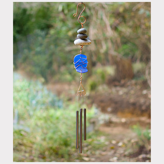 Zen beach stone chime with cobalt blue glass and three brass chime.