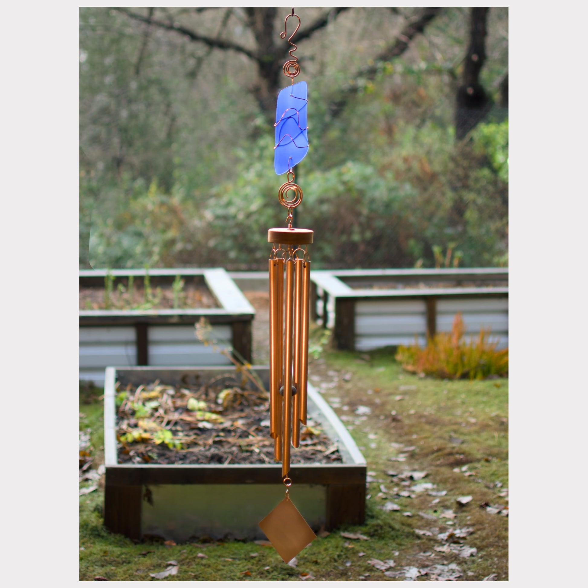 Large handcrafted wind chime with cobalt blue beach glass, hammered copper hardware, and five copper chimes.