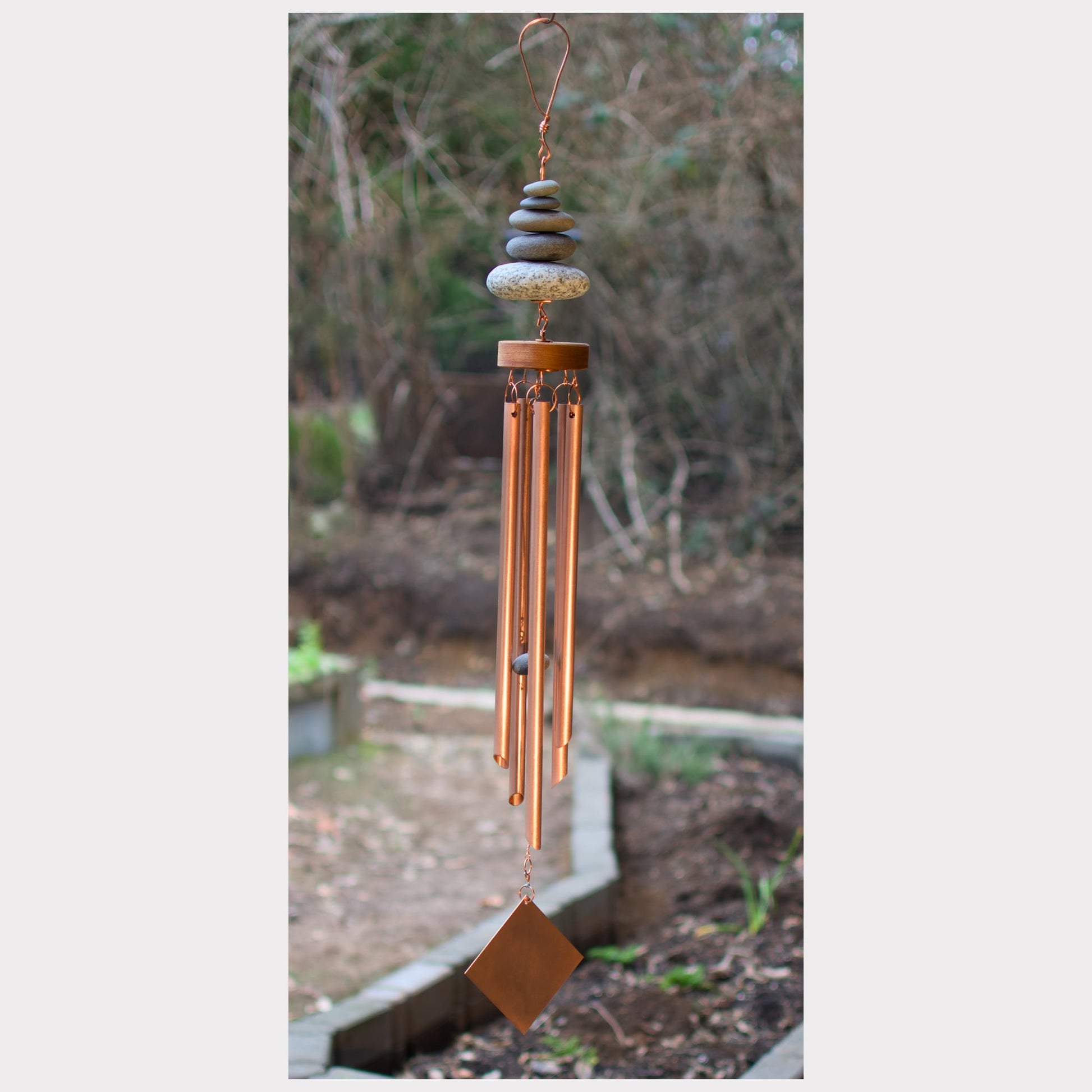 Zen handcrafted wind chime with five beach stones and five copper chimes.