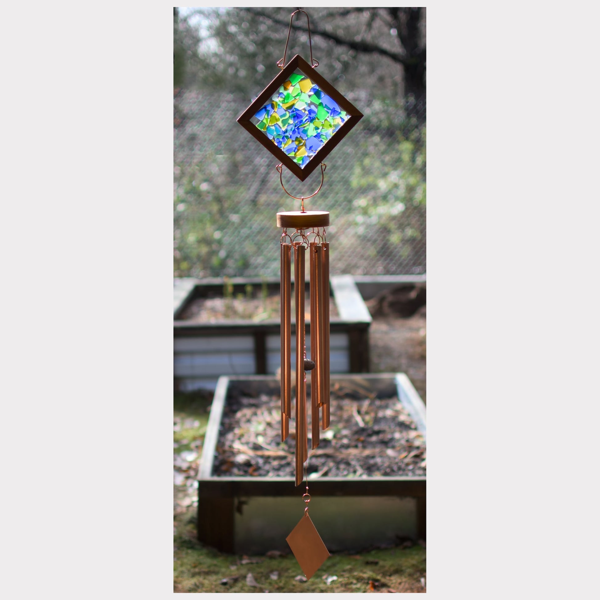 Large kaleidoscope wind chime with artist-made beach glass and seven copper chimes.