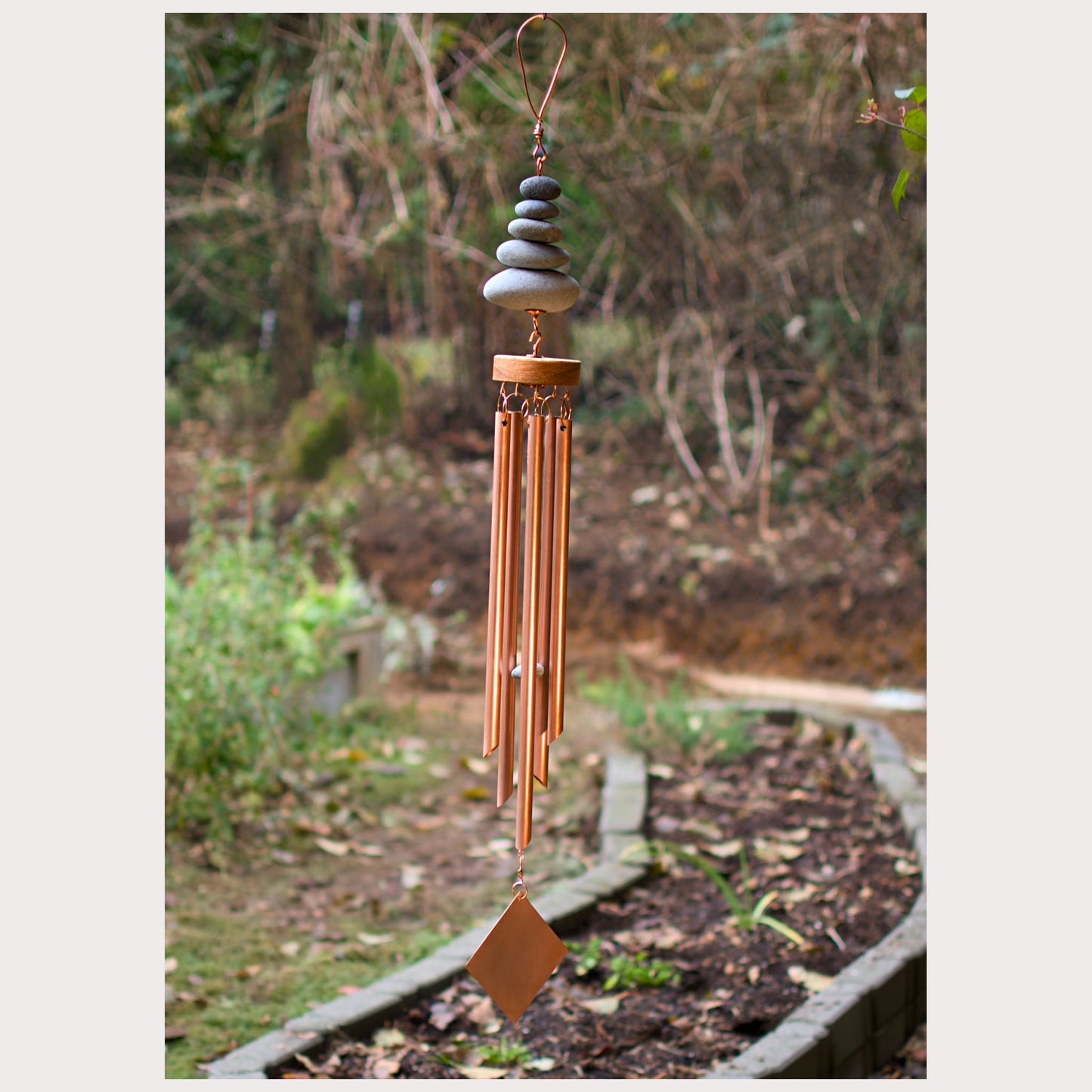 Zen beach stone wind chime with five beach stones and five genuine copper chimes.