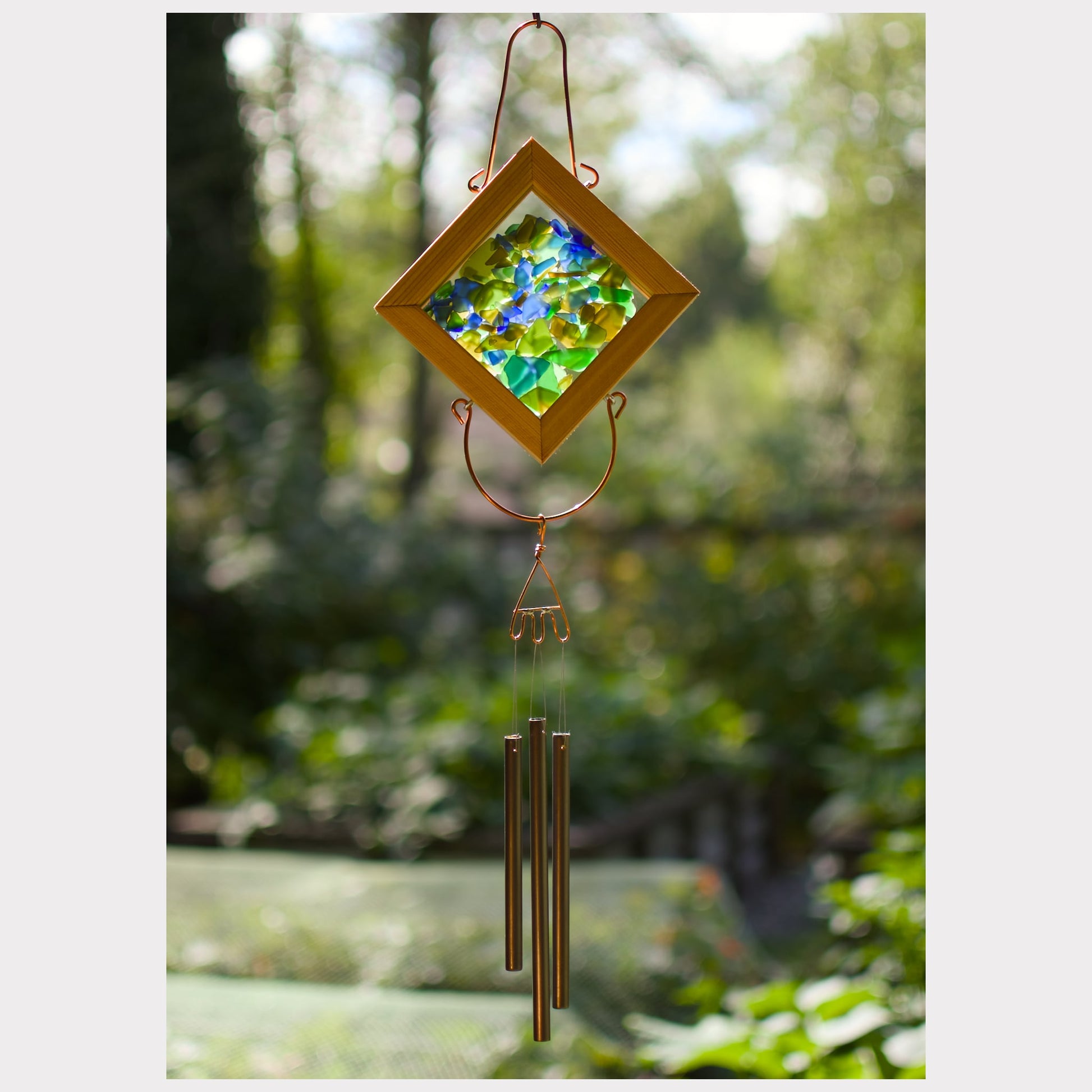 Sea glass kaleidoscope wind chime with 3 brass chimes.