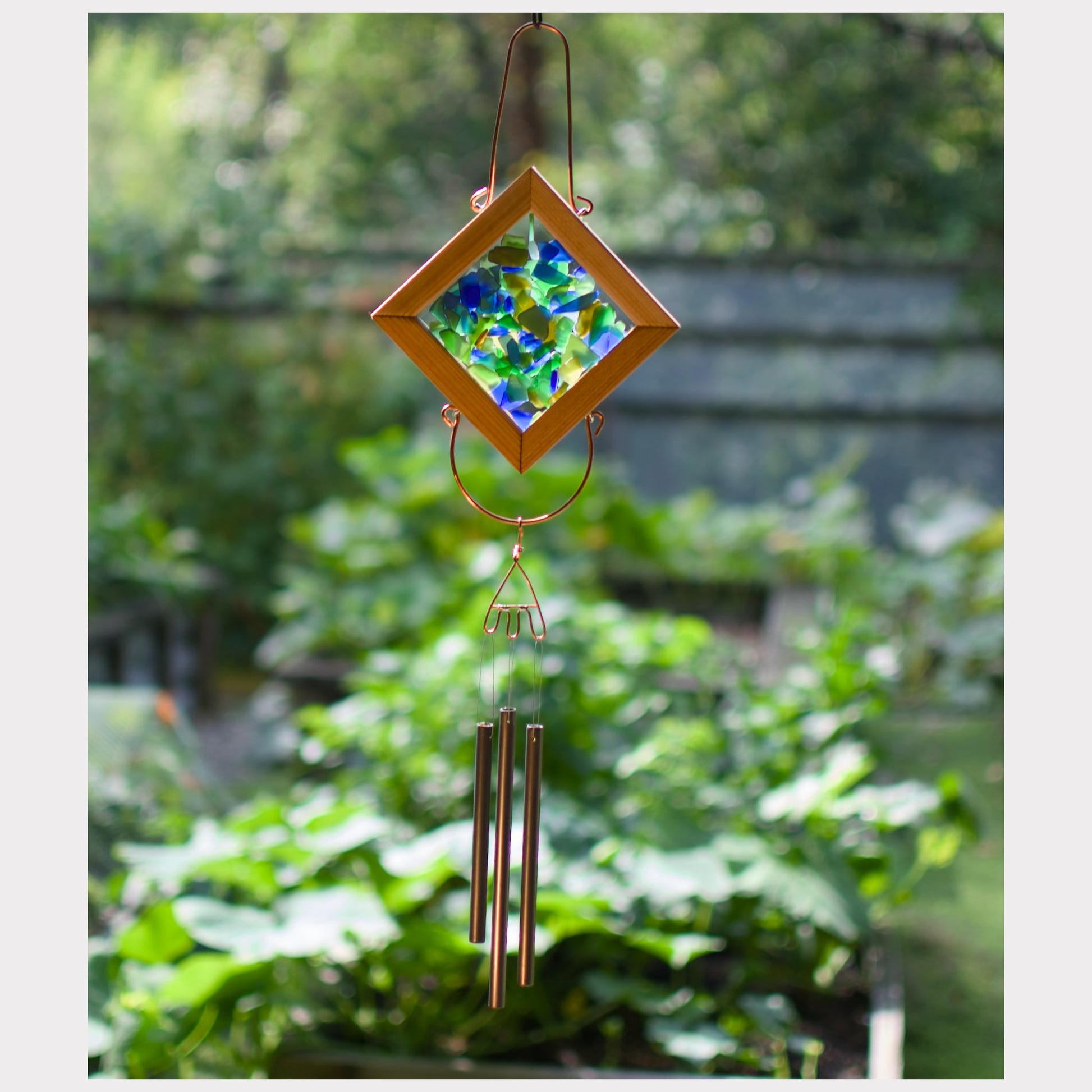 Sea glass kaleidoscope wind chime with three brass chimes.