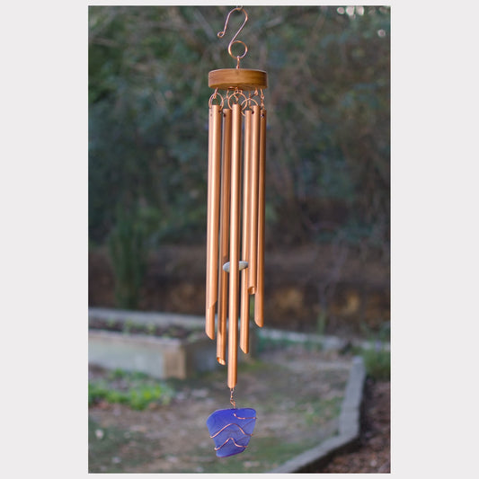 Wind chime featuring seven genuine copper chimes and a cobalt blue sea glass windsail.
