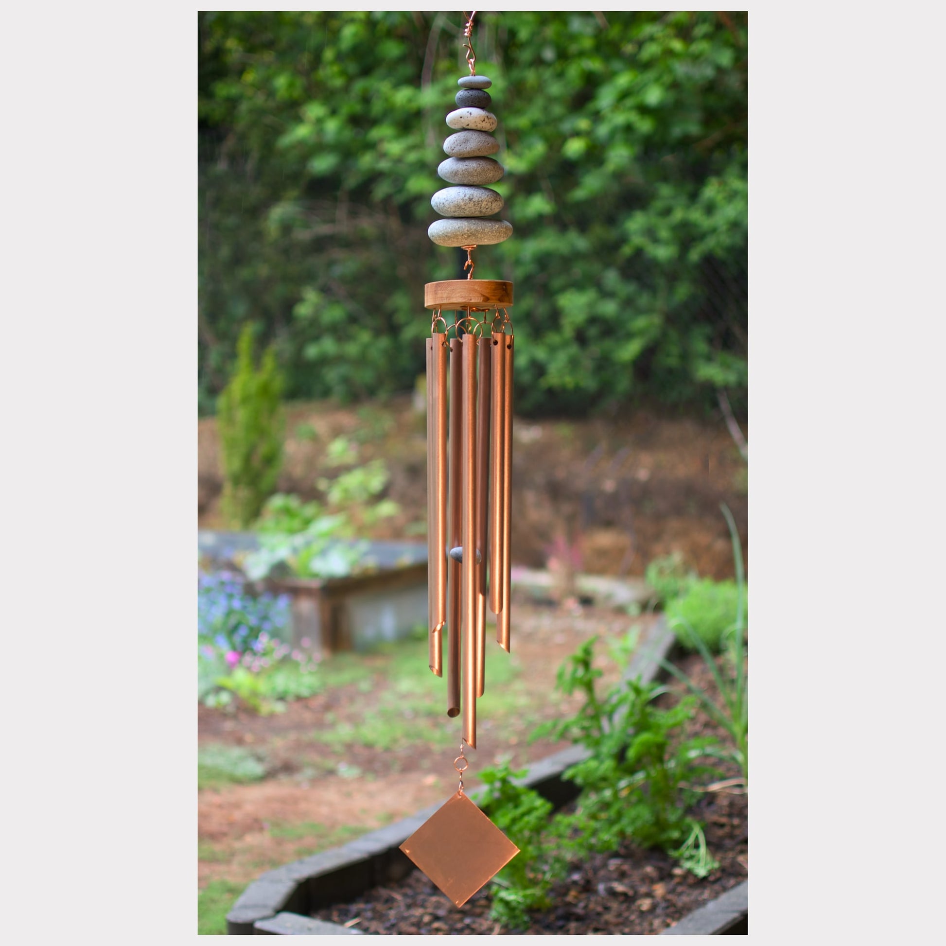 Zen wind chime featuring seven natural beach stones and seven genuine copper chimes.