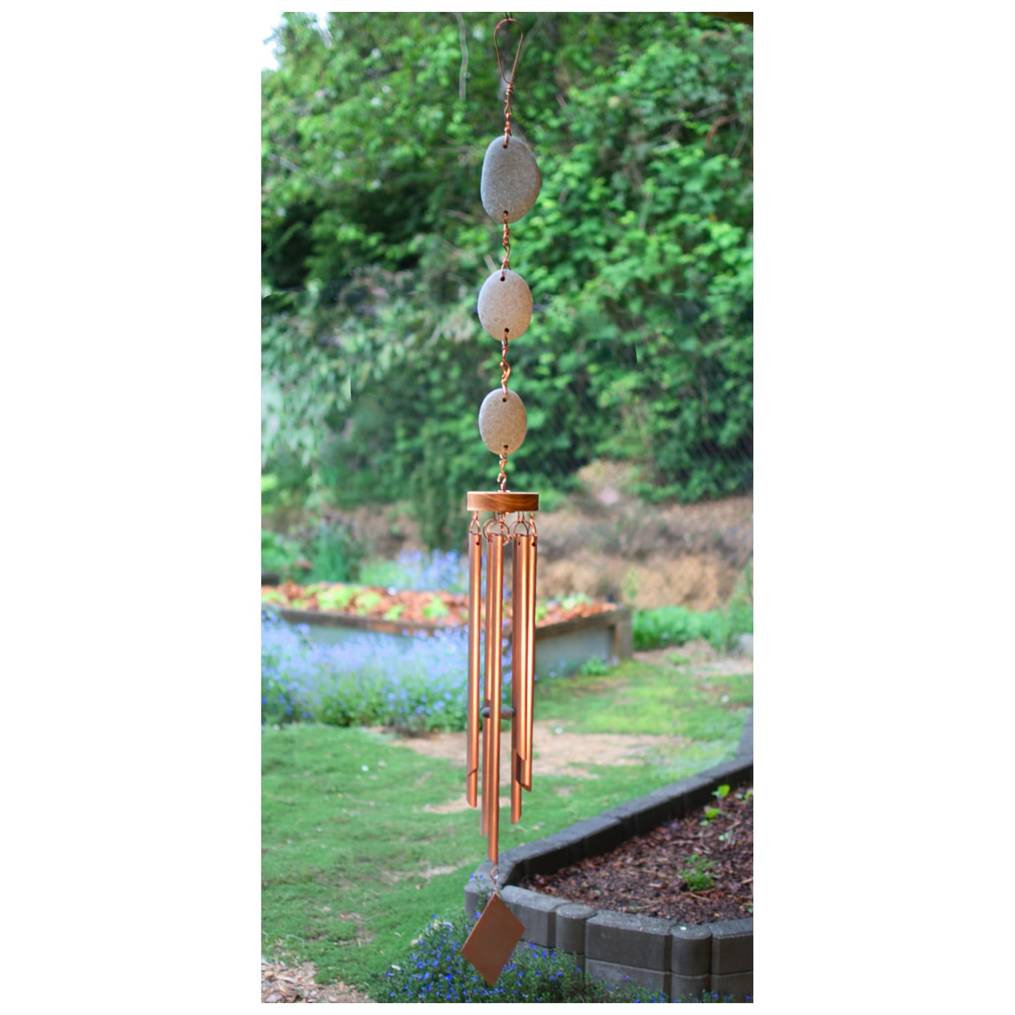 Wind chime featuring 3 natural beach stones and 7 genuine copper chimes.