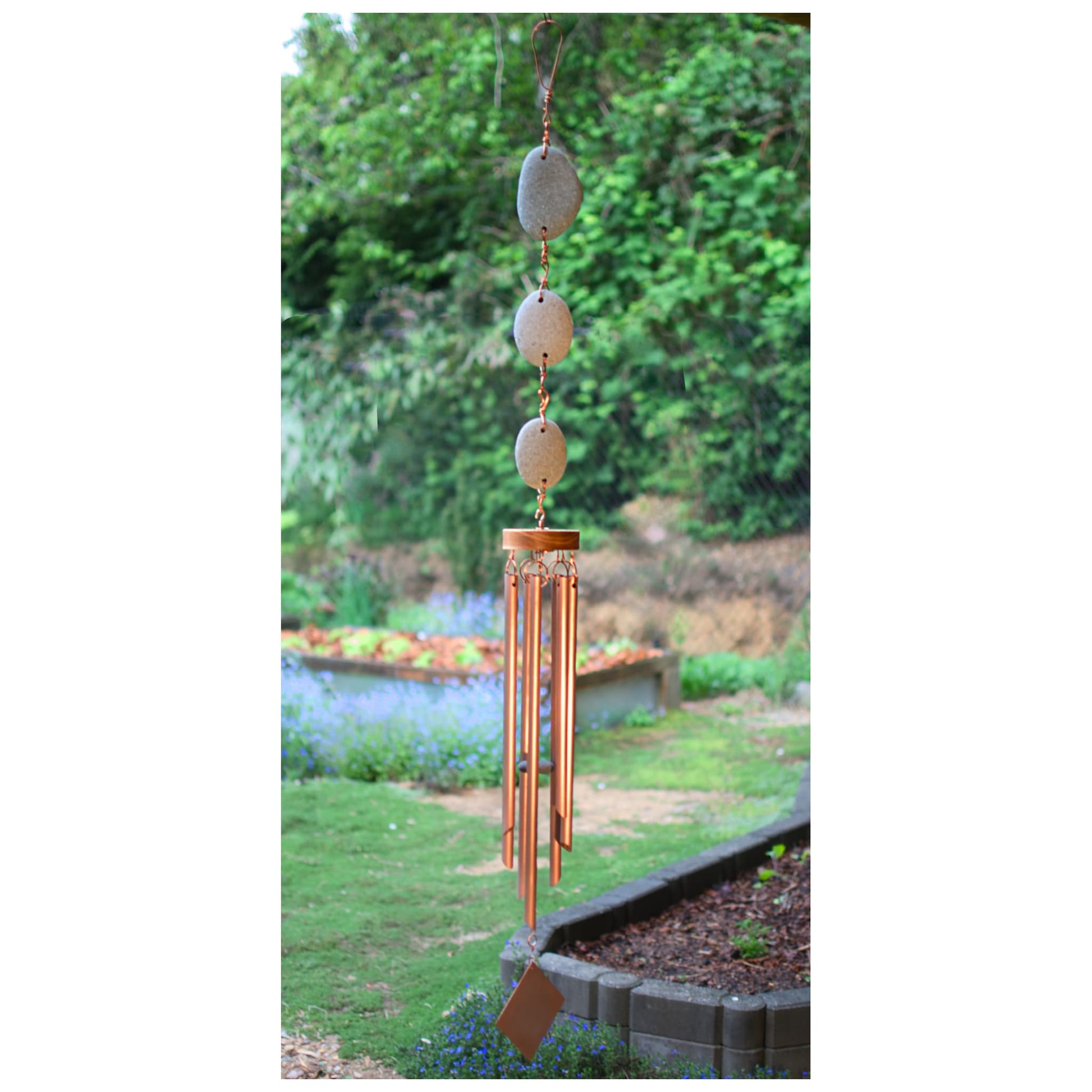 Wind chime featuring 3 natural beach stones and 7 genuine copper chimes.