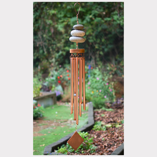 Zen wind chime featuring three natural beach stones and seven genuine copper chimes.