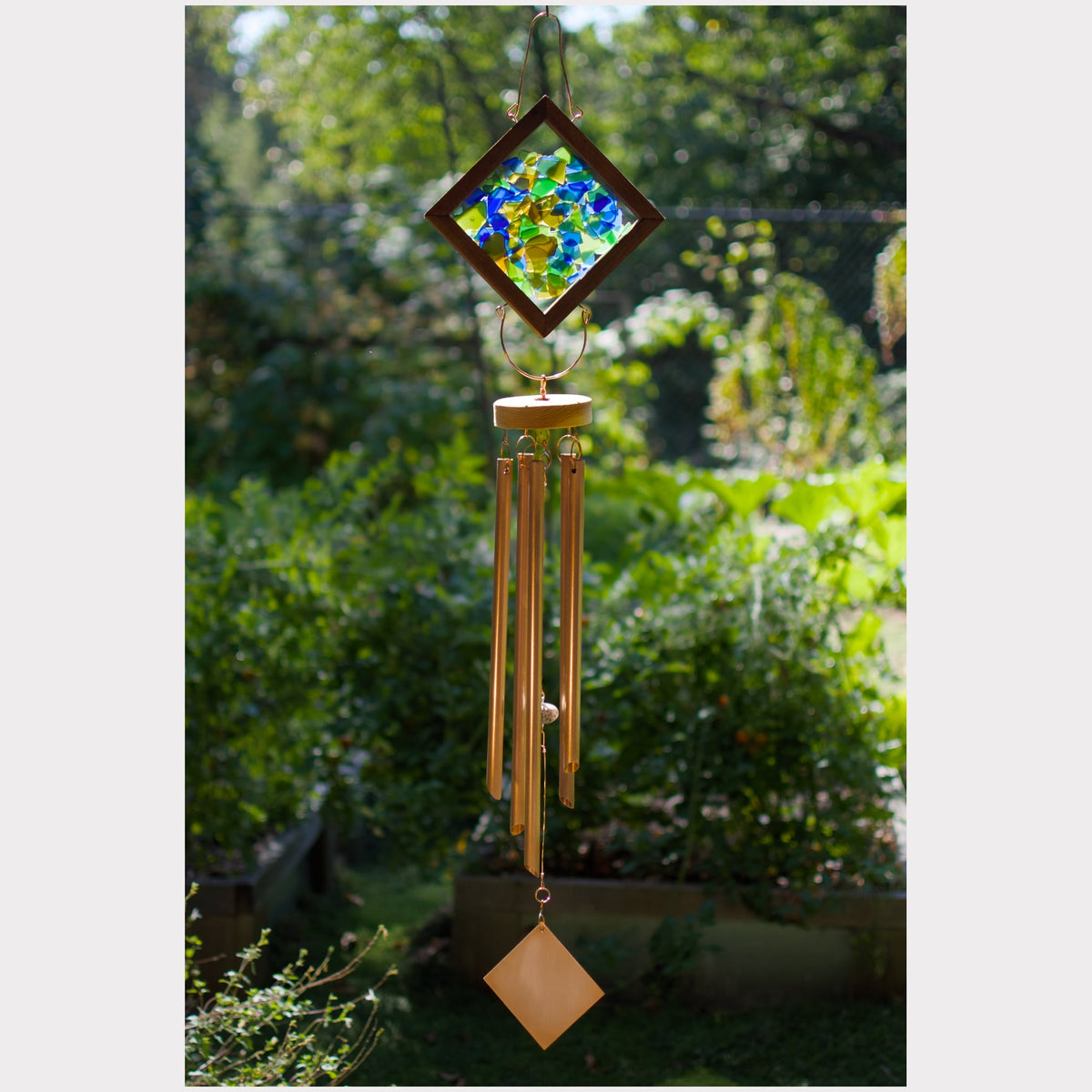 Kaleidoscope wind chime featuring artist-made beach glass and five genuine copper chimes.