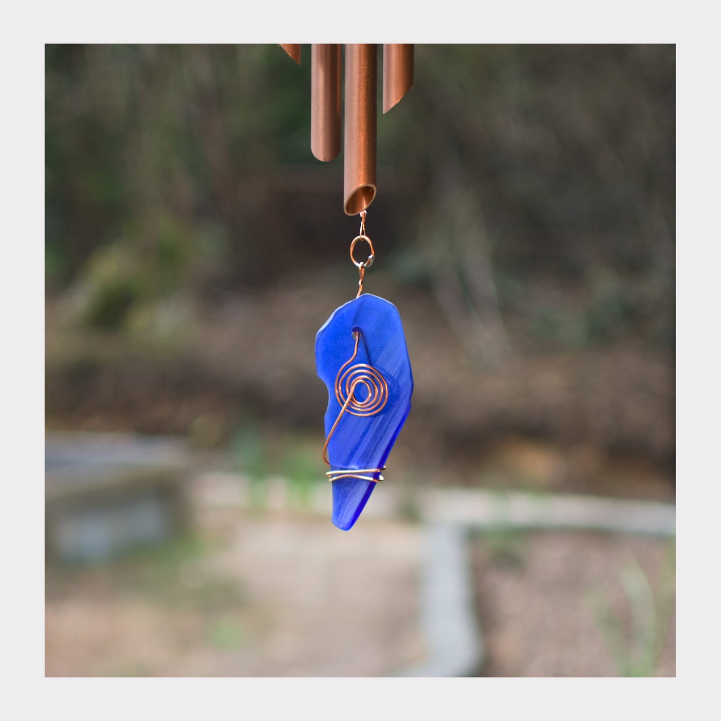 detail, cobalt blue artist-made beach glass windsail for a wind chime