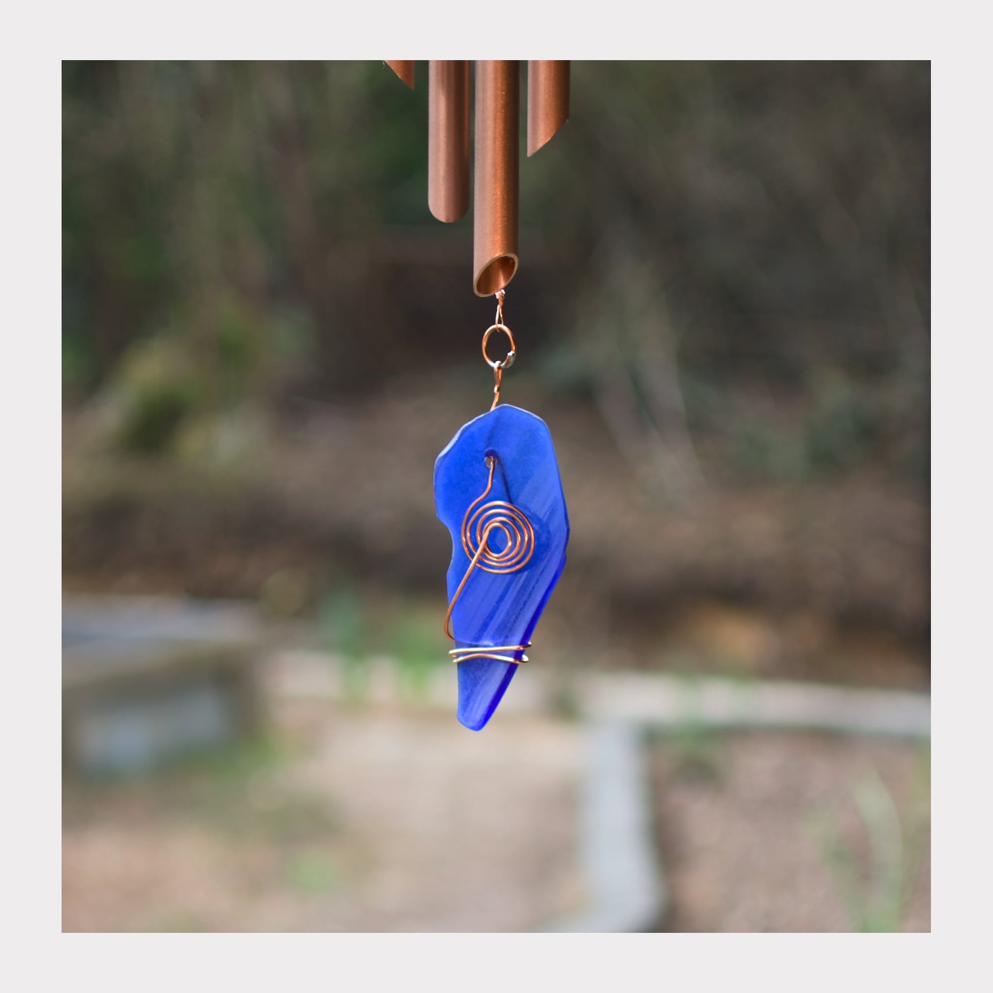 detail, cobalt blue artist-made beach glass windsail for a wind chime