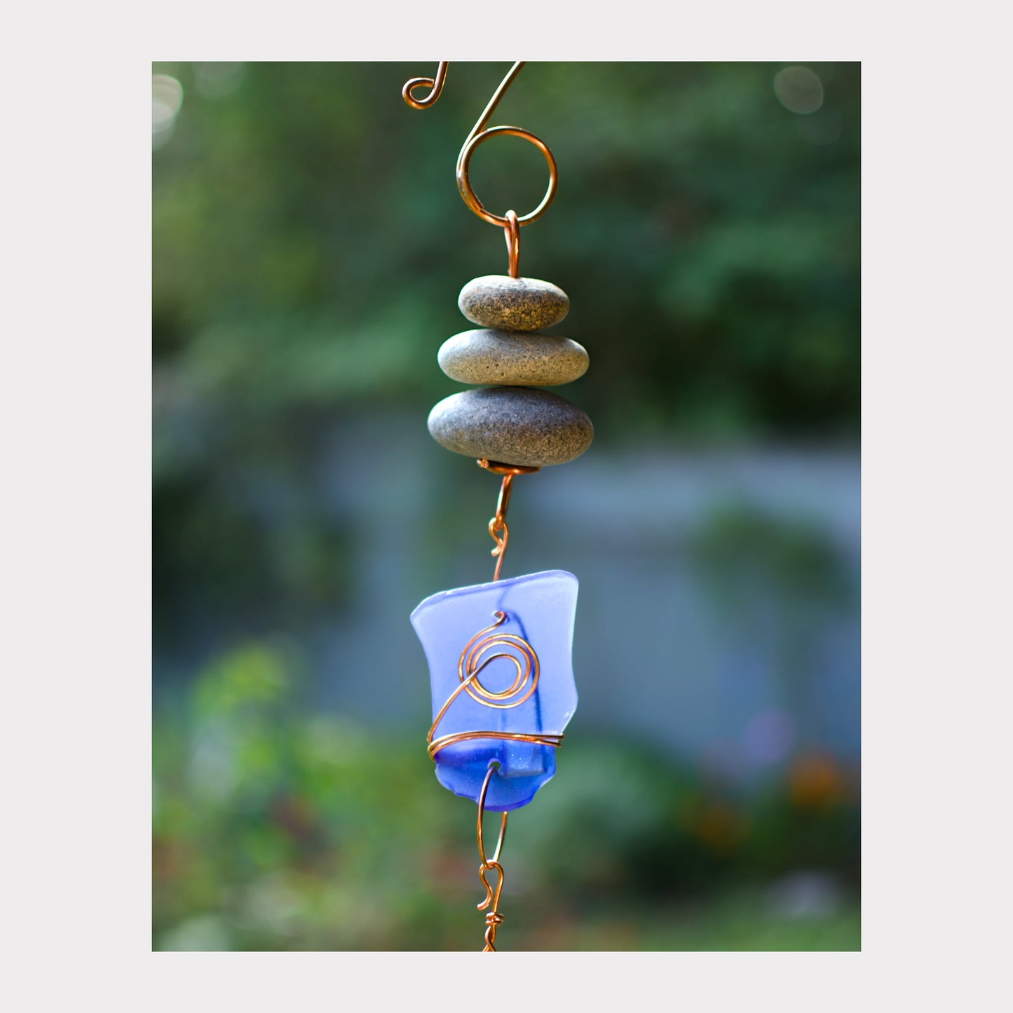 detail, beach stone and cobalt blue glass wind chime