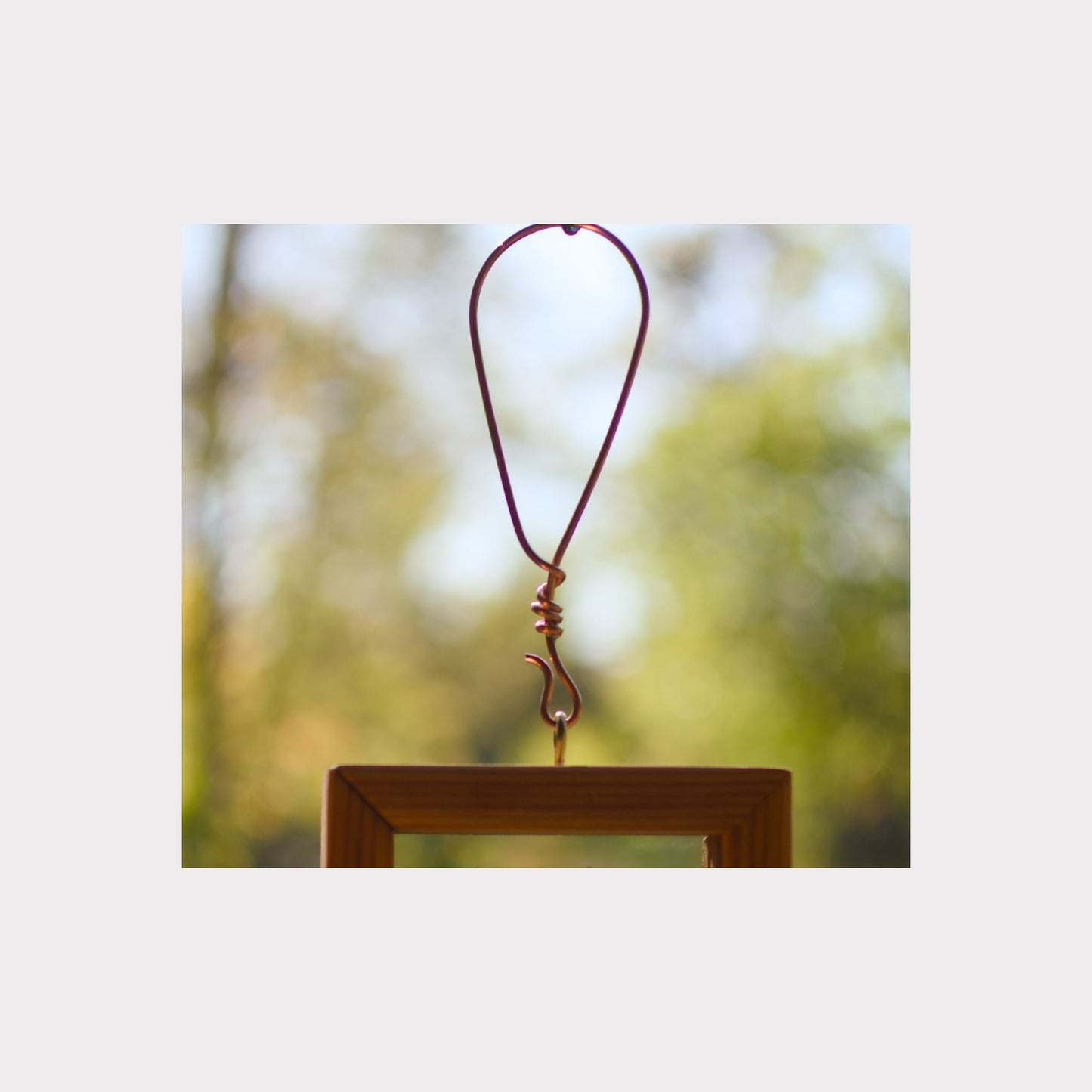 Handmade copper hanging loop for a large wind chime.