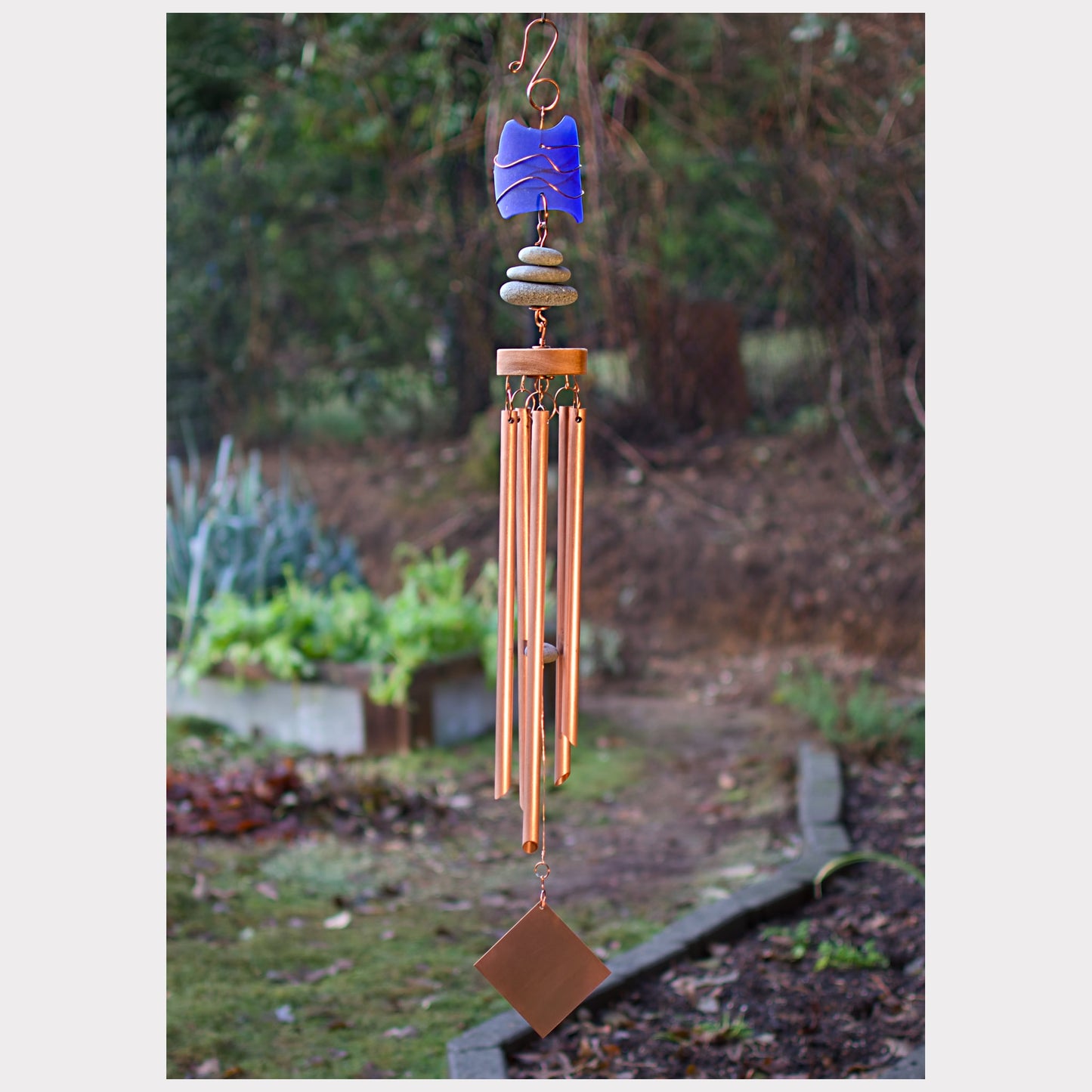 Large copper wind chime with cobalt blue beach glass, three beach stone, and five chimes.