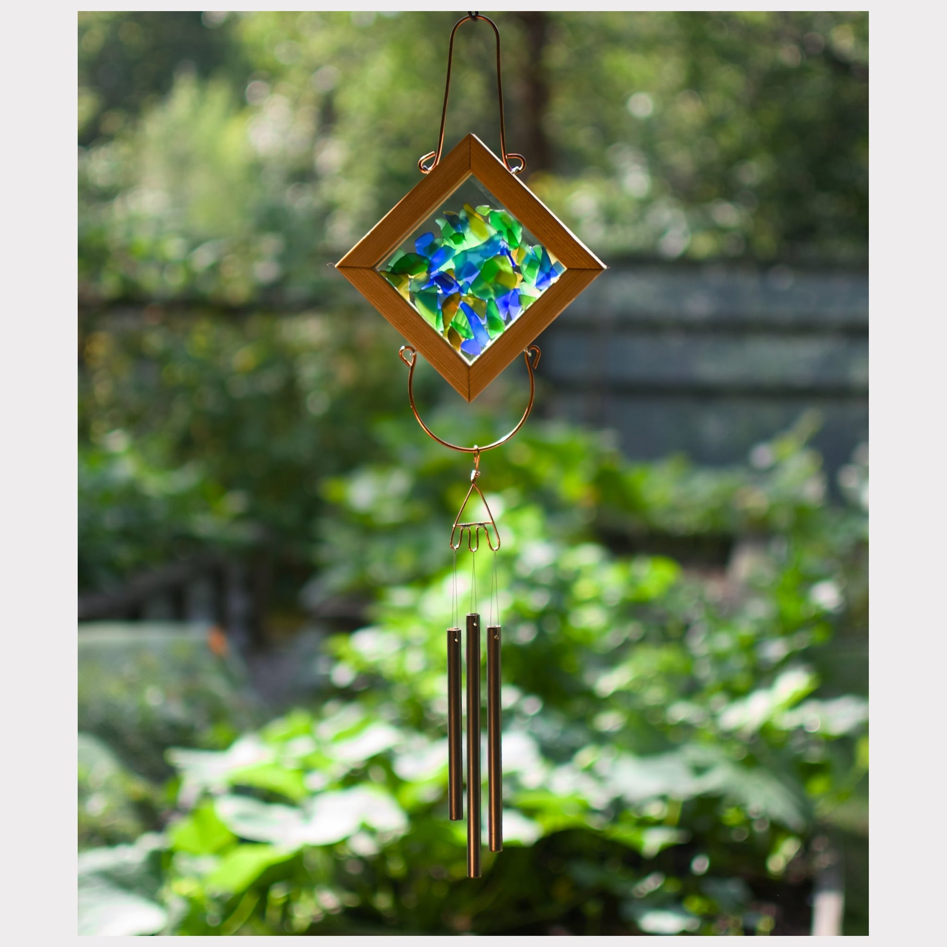 Sea glass kaleidoscope wind chime with three brass chimes.