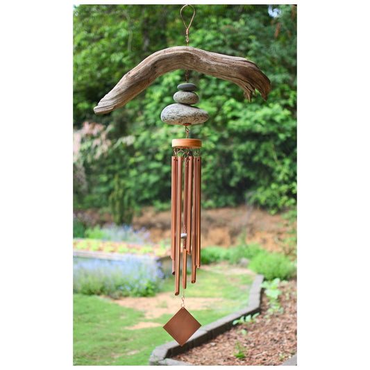 Wind chime featuring large driftwood and beach stones, seven genuine copper chimes.