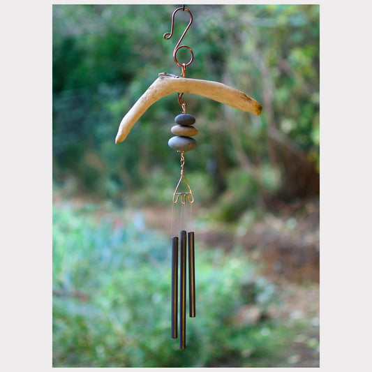 Natural driftwood and beach stone chime.