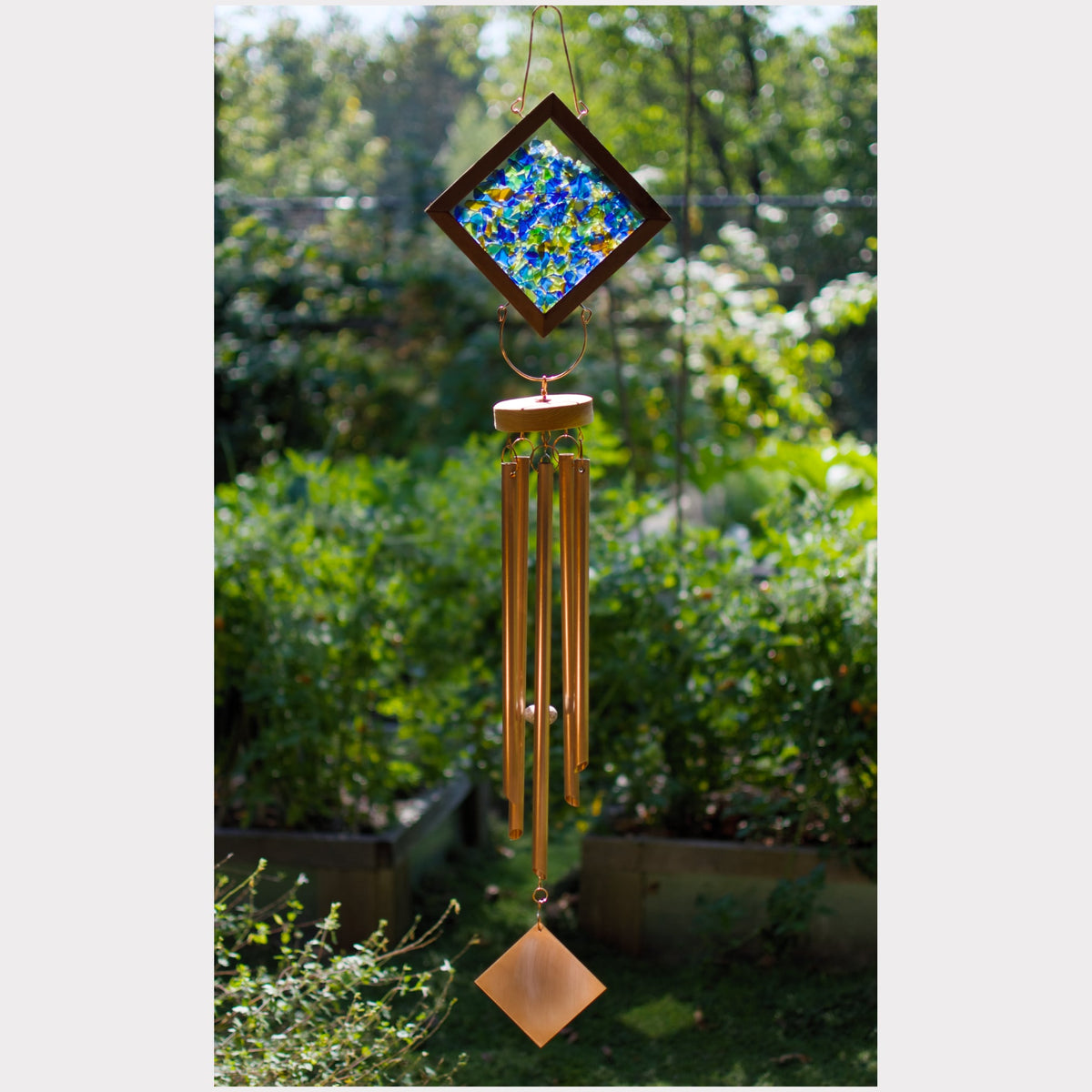 Kaleidoscope wind chime featuring artist-made beach glass and five genuine copper chimes.