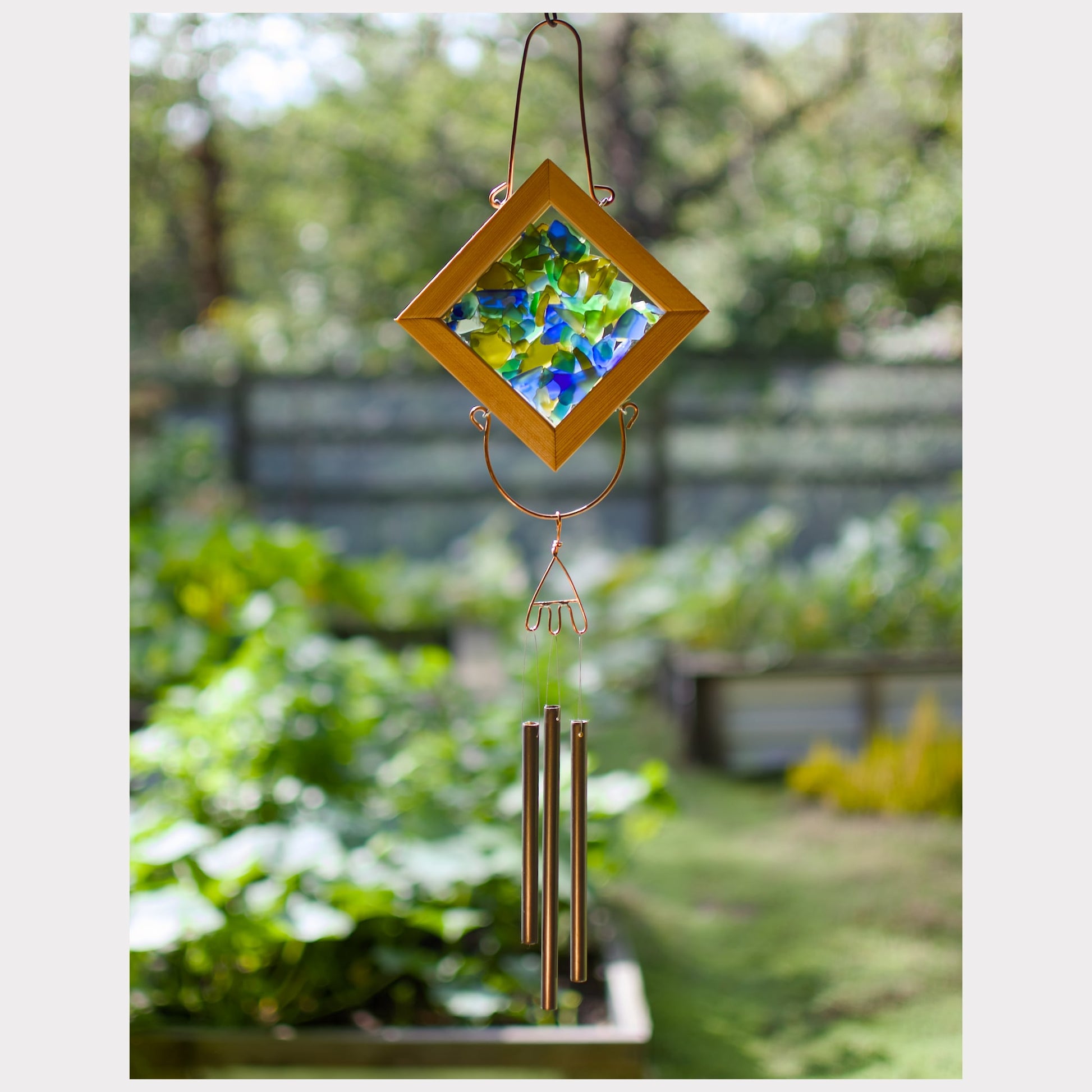 Sea glass kaleidoscope wind chime with three brass chimes.