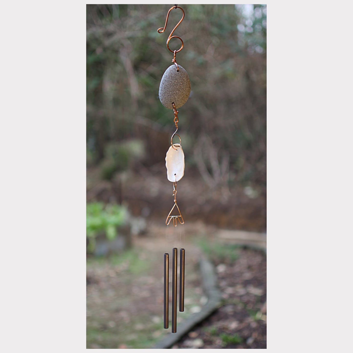 Zen beach stone and oyster shell wind chime.