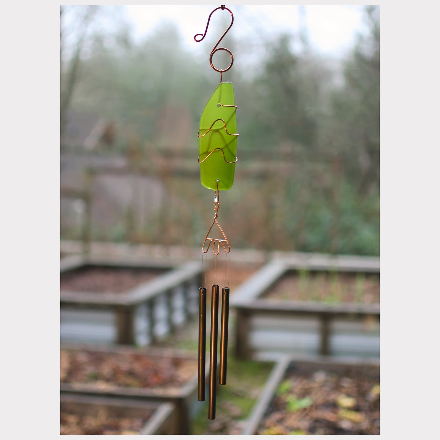 Glass sun catcher wind chime with three antiqued brass chimes.