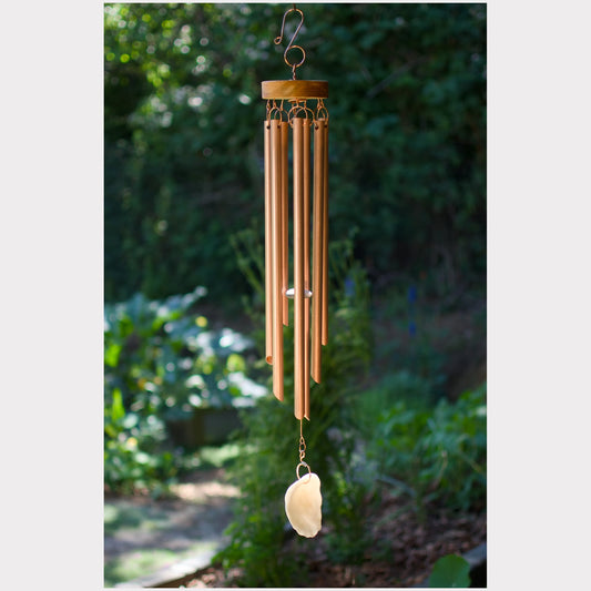 Handmade wind chime featuring 7 genuine copper chimes and an oyster half shell windsail.